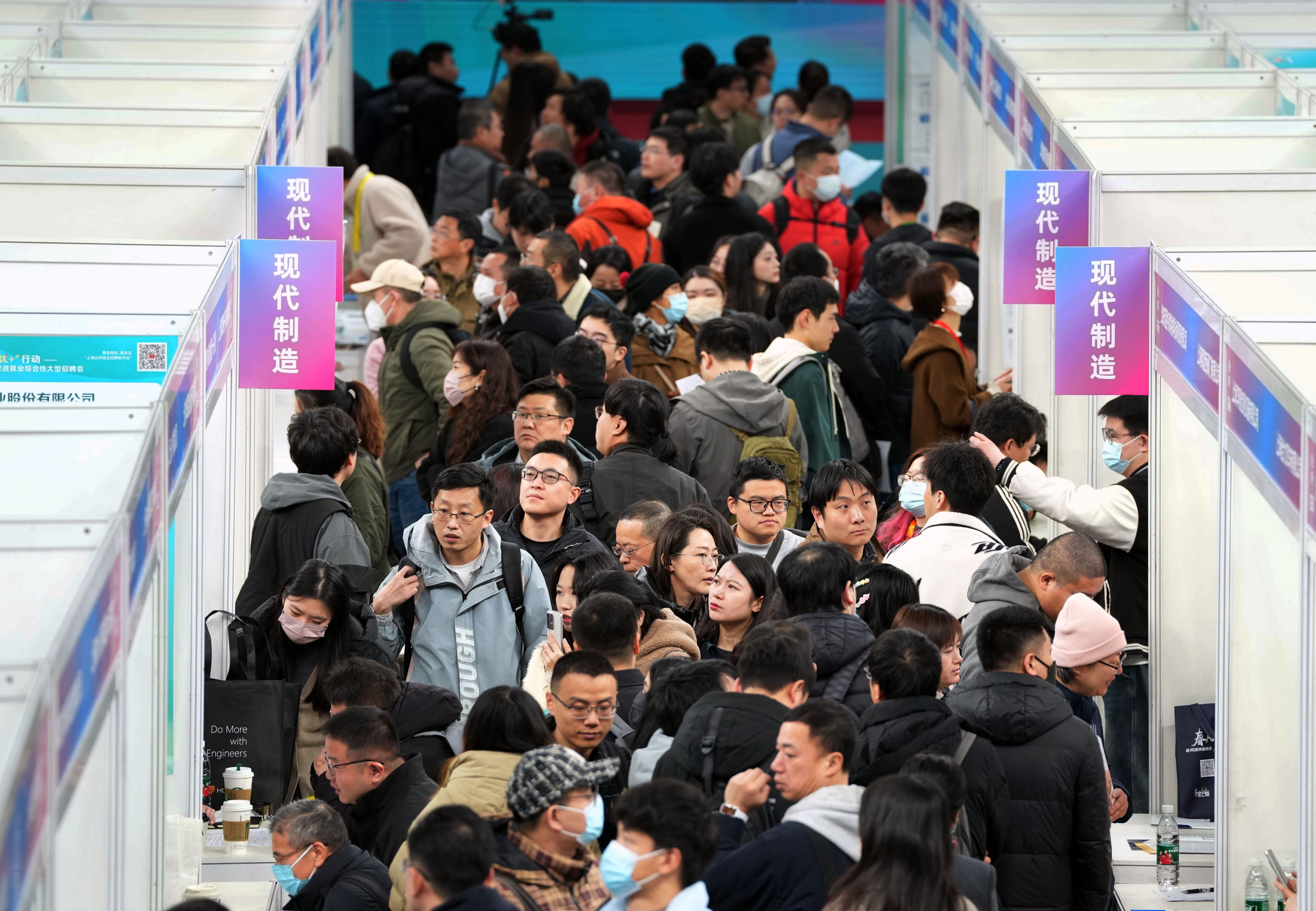 Job seekers attend a job fair in Shanghai on February 14. Given China’s high youth unemployment rate, for low-income families, the investment of hard-earned savings into higher education is becoming harder to justify. Photo: Xinhua