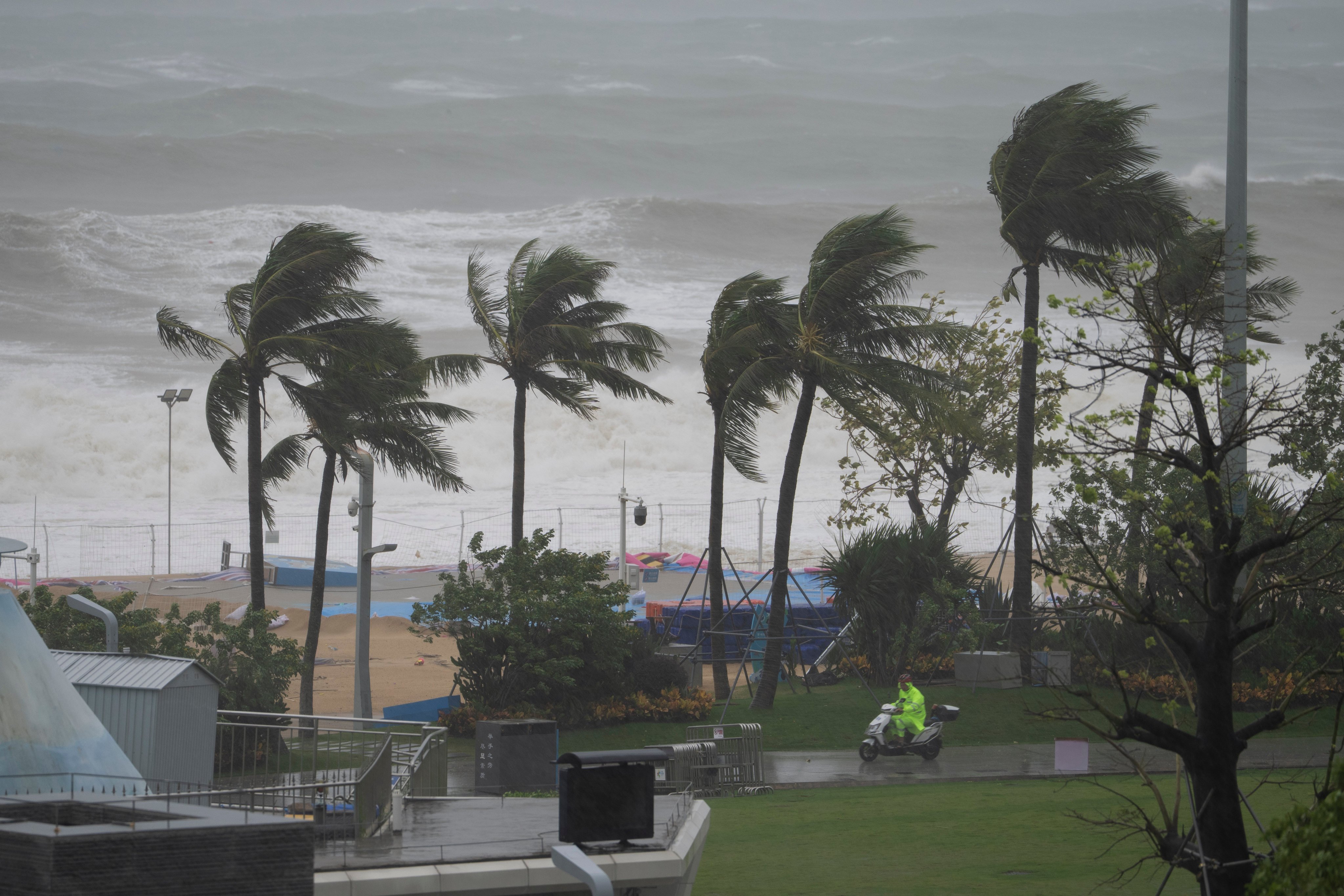 A security person patrols along a beach in Shenzhen, as Super Typhoon Ragasa moves near the area. Photo: AP
