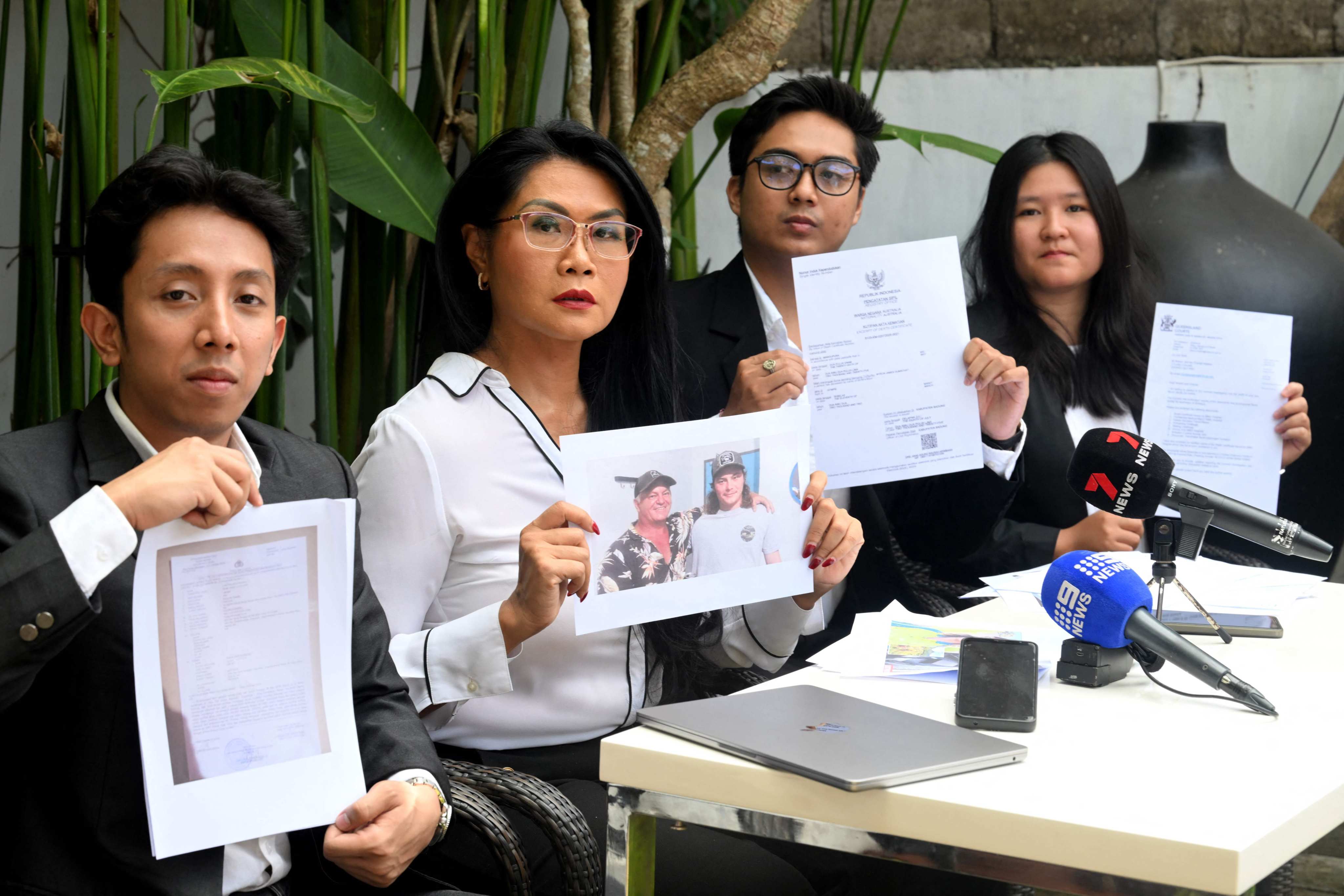 The legal team for the family of Australian national Byron Haddow hold up documents during a press conference at Tibubeneng Badung regency on Indonesia’s resort island of Bali on Wednesday. Photo: AFP