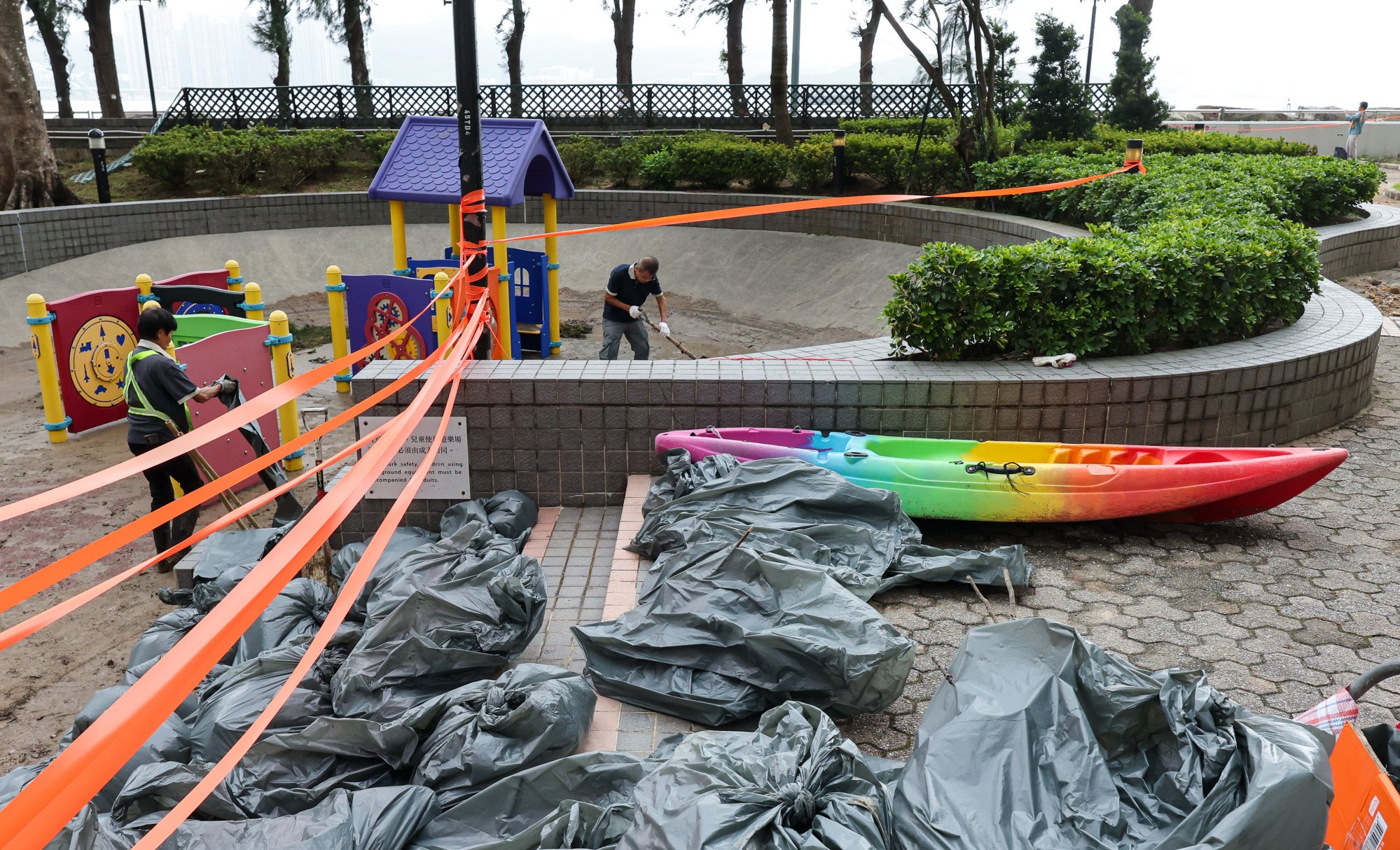 Workers clean up a playground in Heng Fa Chuen after Ragasa. Photo: Jelly Tse Workers clean up a playground in Heng Fa Chuen after Ragasa. Photo: Jelly Tse