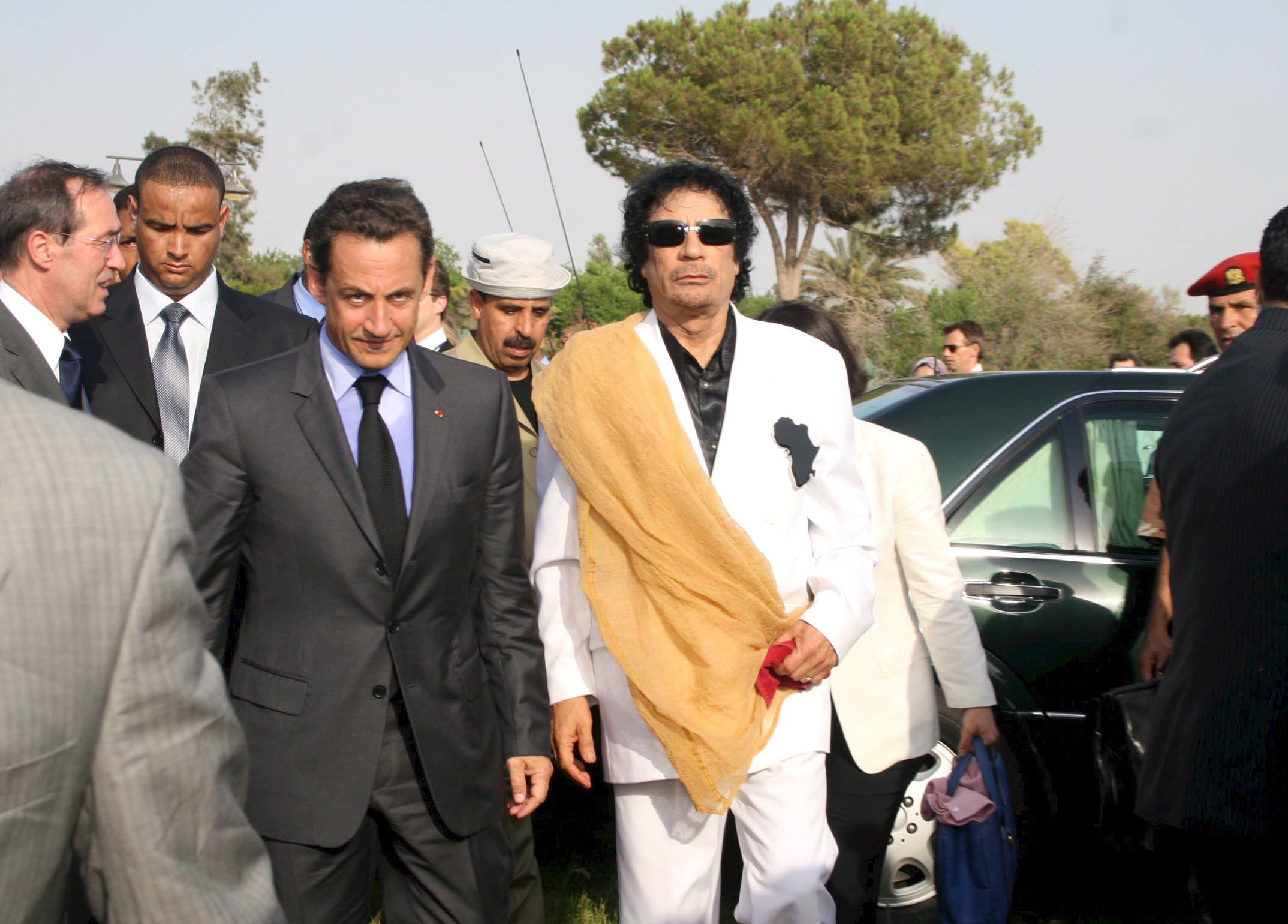 Muammar Gaddafi (right) and Nicolas Sarkozy arrive at Bab Azizia Palace in Tripoli in July 2007. Photo: EPA-EFE