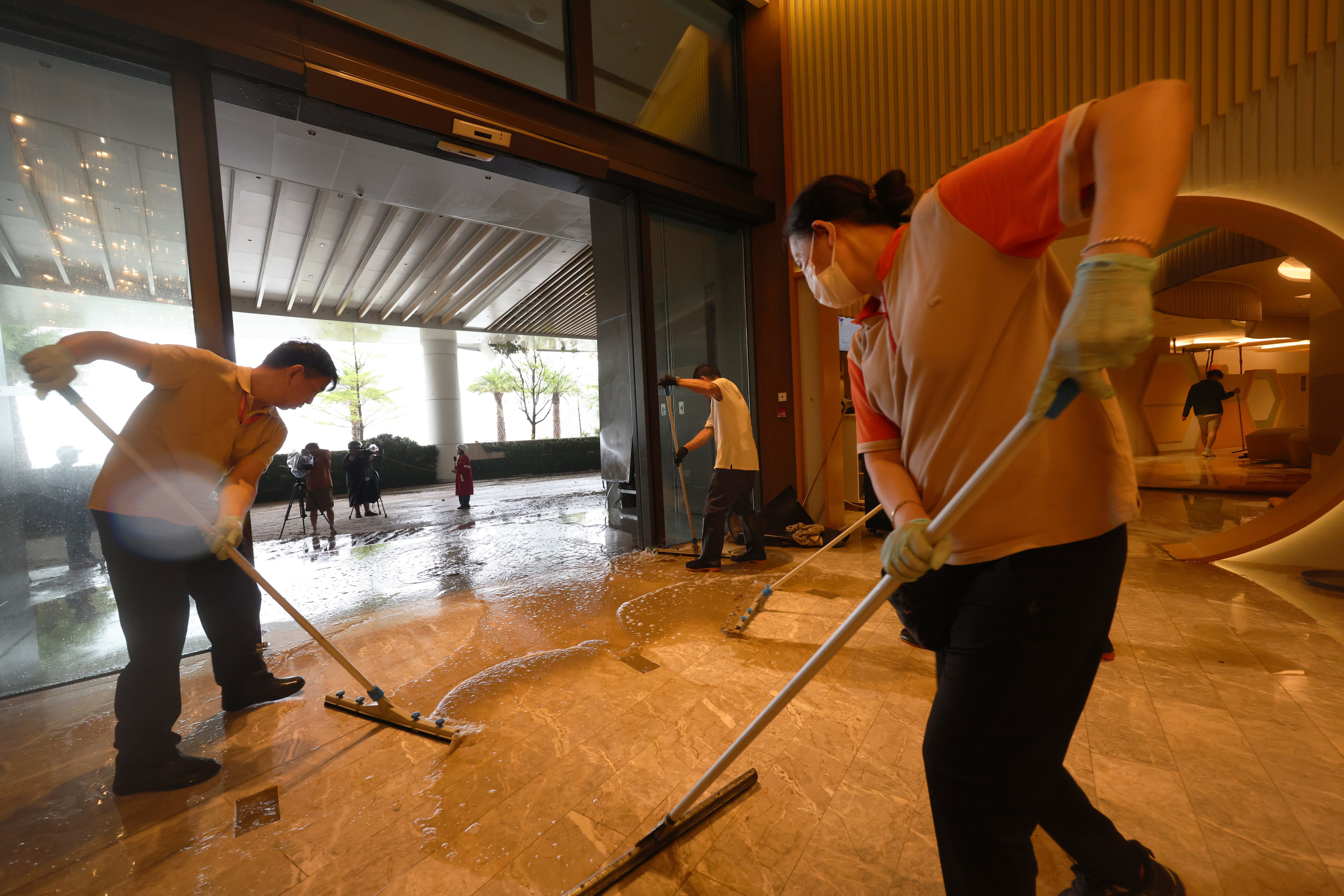Workers mop up at the Fullerton Ocean Park Hotel. Photo: Jelly Tse