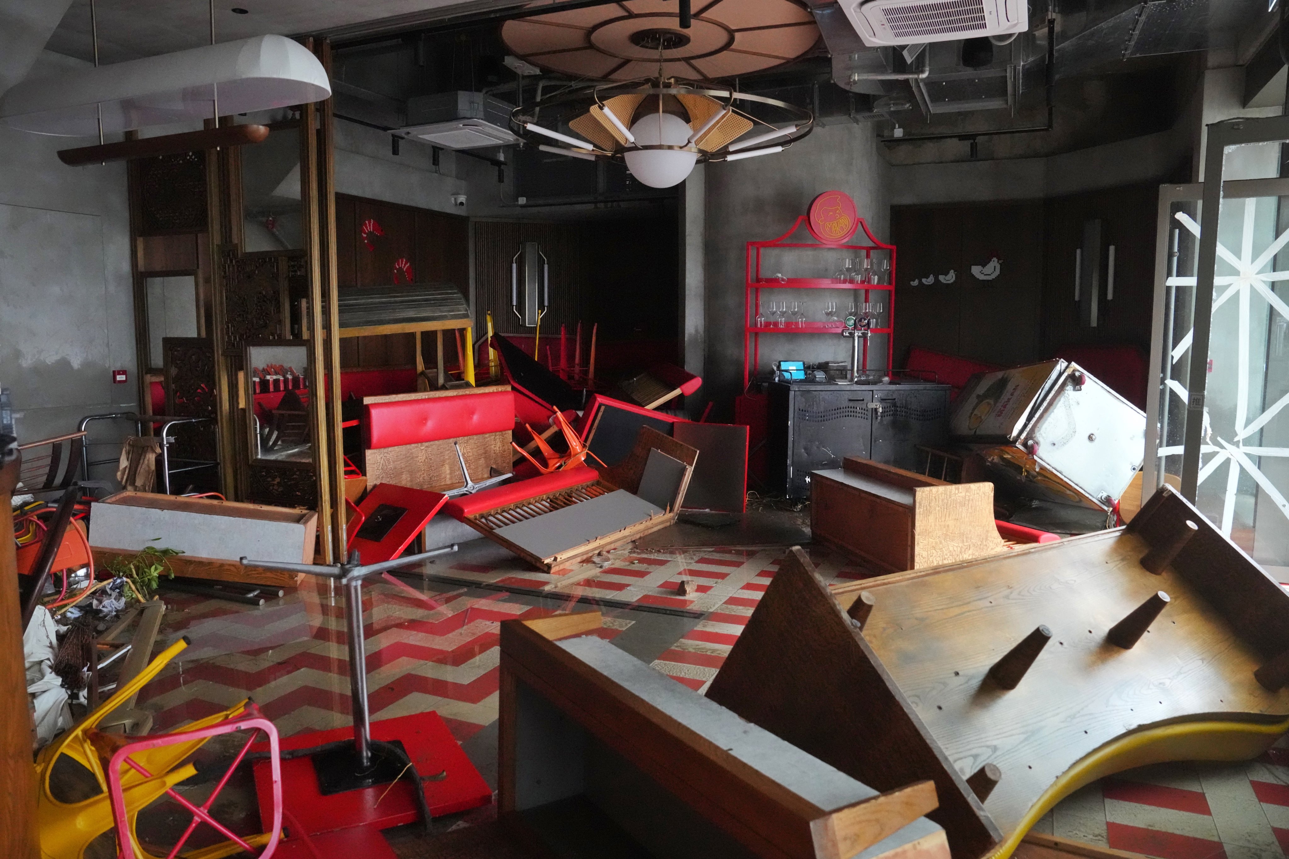 A restaurant in Tseung Kwan O wrecked by the typhoon. Owners of eateries along the coast have said the storm will cost them millions of dollars. Photo: Elson Li