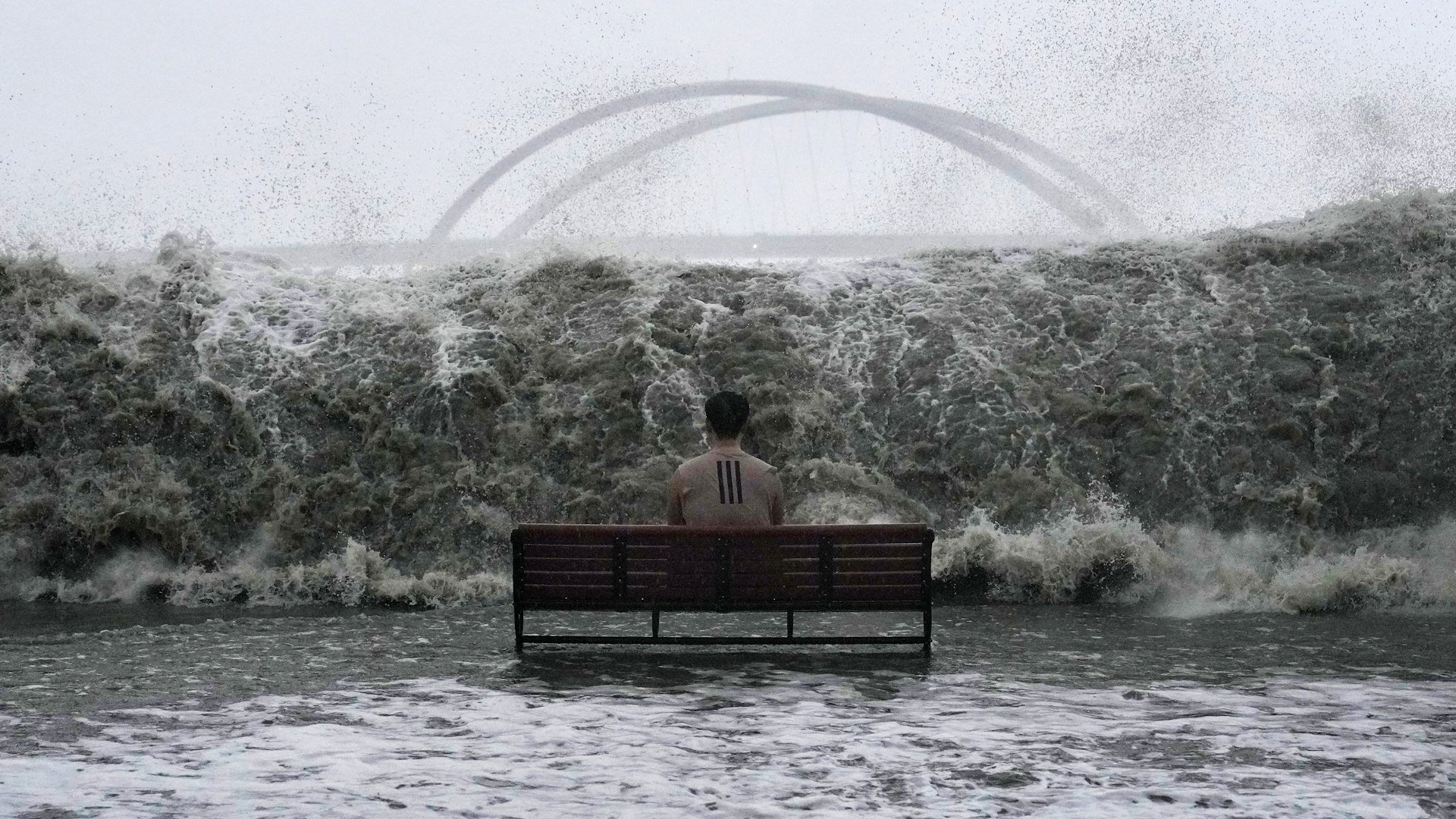 A man sits on a bench at Tseung Kwan O Promenade and was hit by Swells when T10 is issued as Super Typhoon Ragasa is approaching Hong Kong.  24SEP25 SCMP / Elson Li