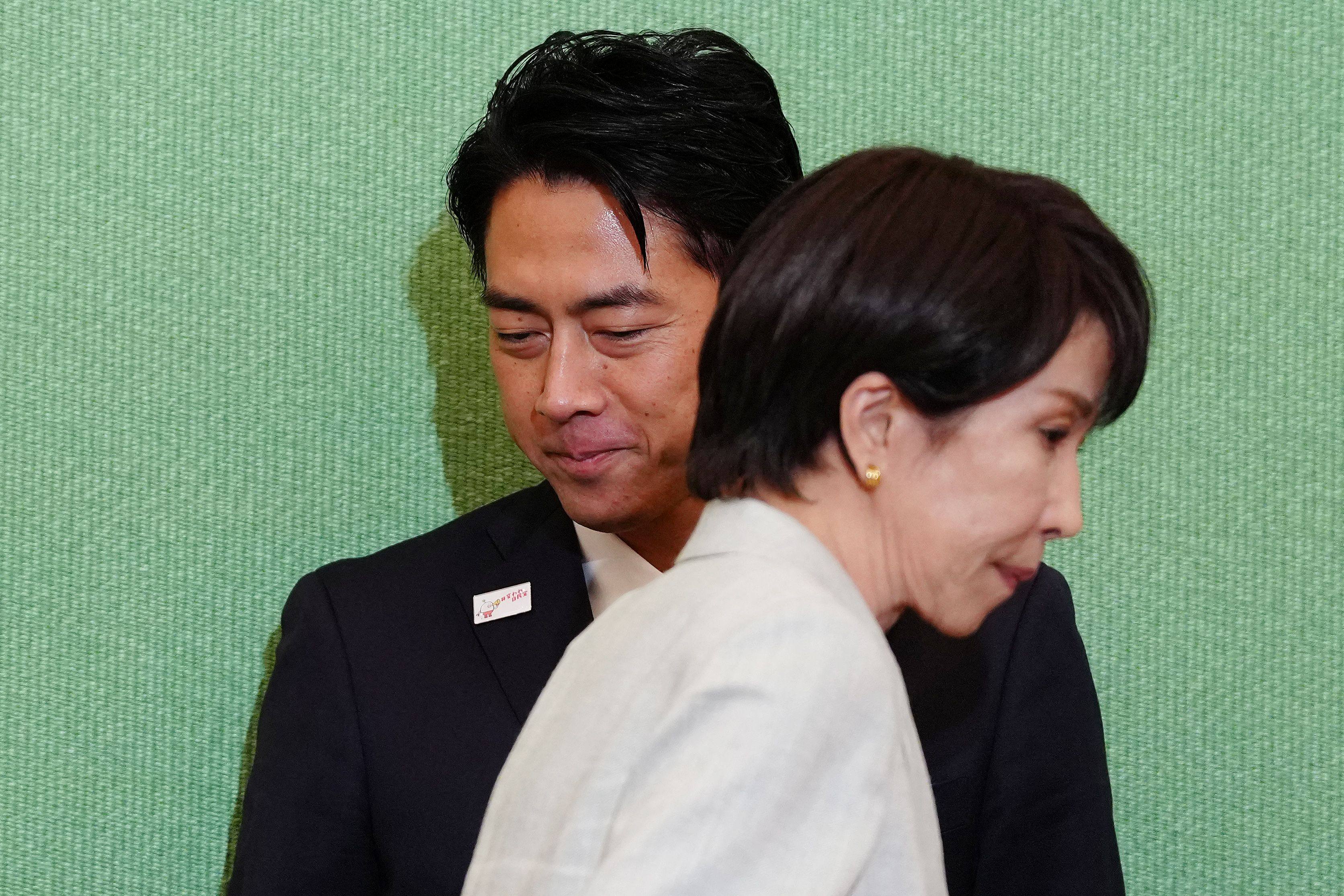 Japan’s Agriculture Minister Shinjiro Koizumi (left) and former economic security minister Sanae Takaichi are seen before the Liberal Democratic Party (LDP) presidential election candidate debate in Tokyo on Wednesday. Photo: AFP