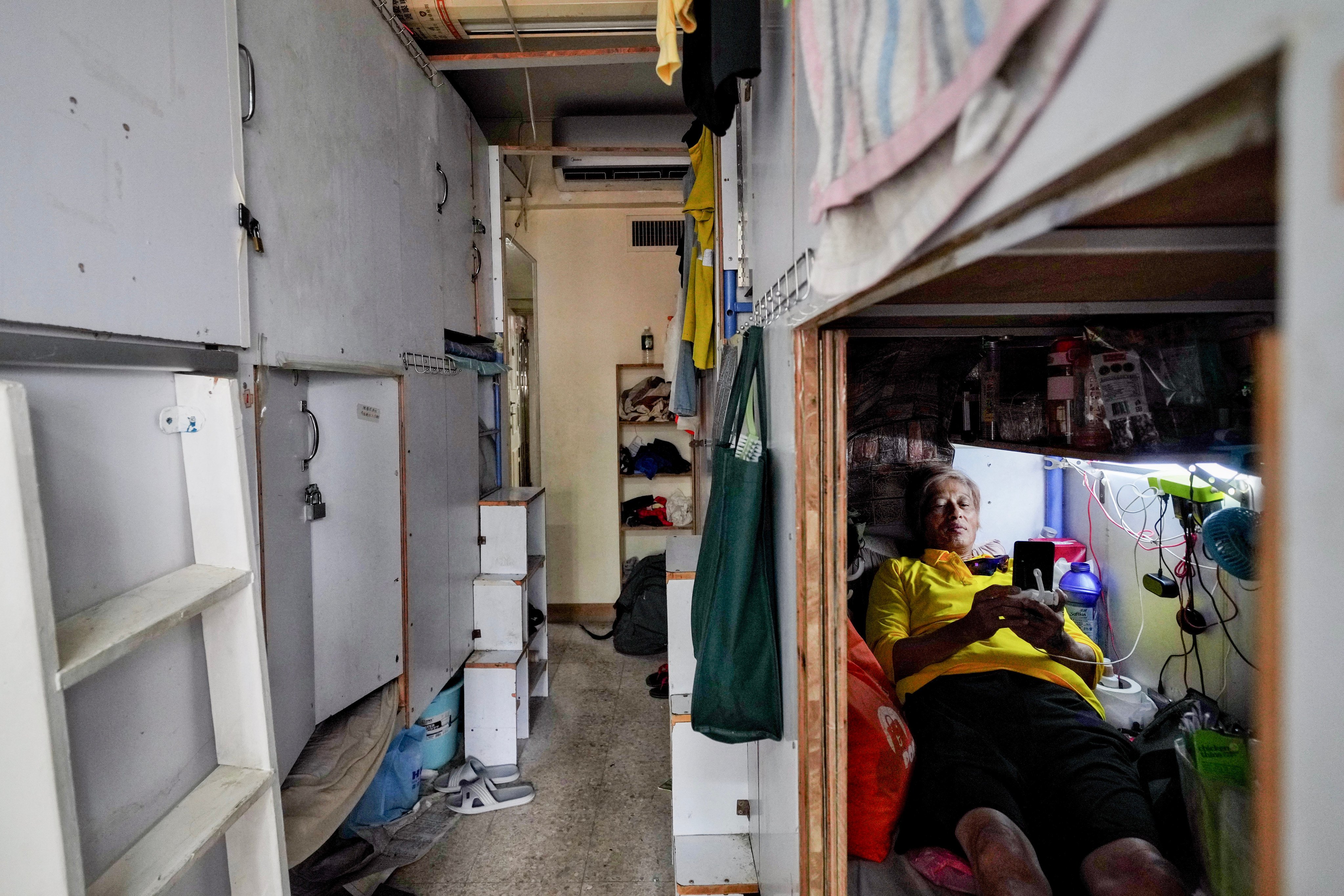 A housing unit subdivided into bunk bed spaces of less than 20 sq ft in Sham Shui Po, Hong Kong. Photo: Elson Li