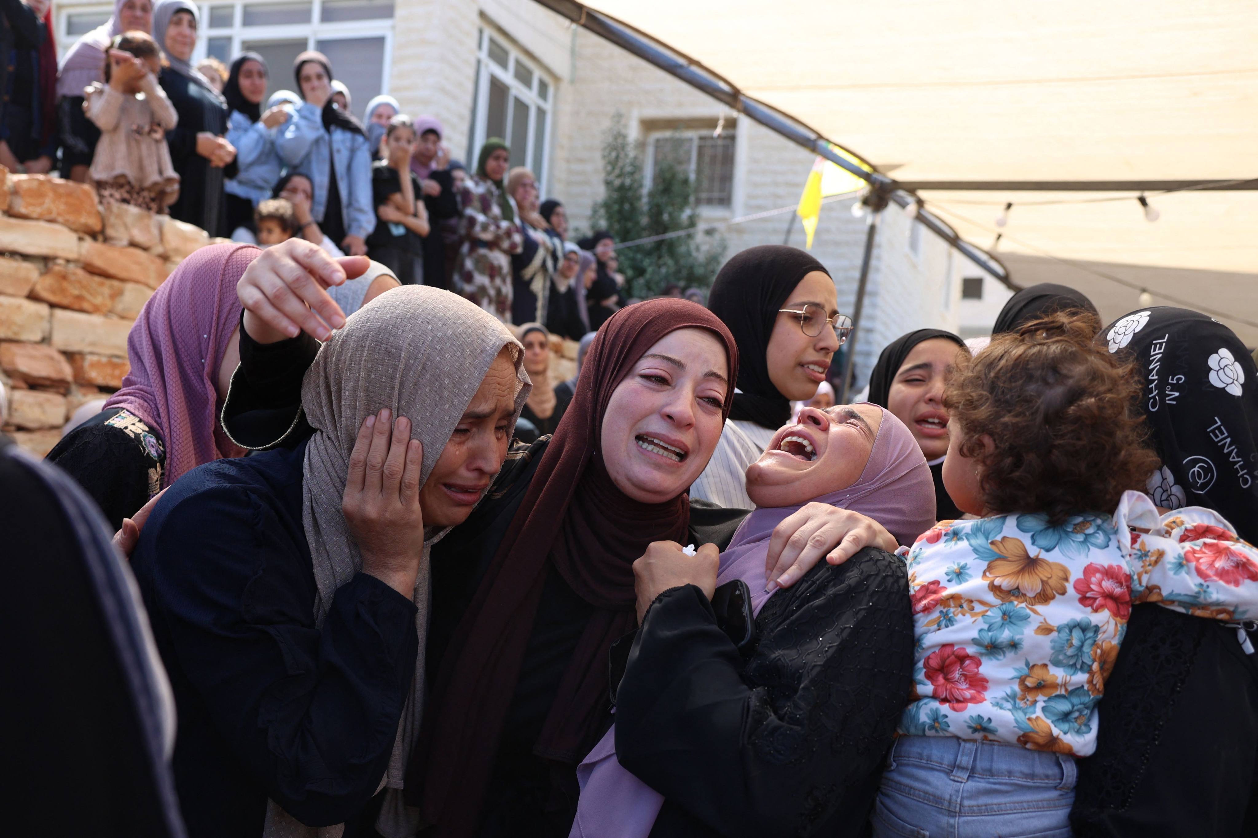 Palestinian women mourn during the funeral of a man, who was killed during clashes with Israeli settlers the previous day, in the occupied West Bank village of Al-Mughayyir on Wednesday. Photo: AFP