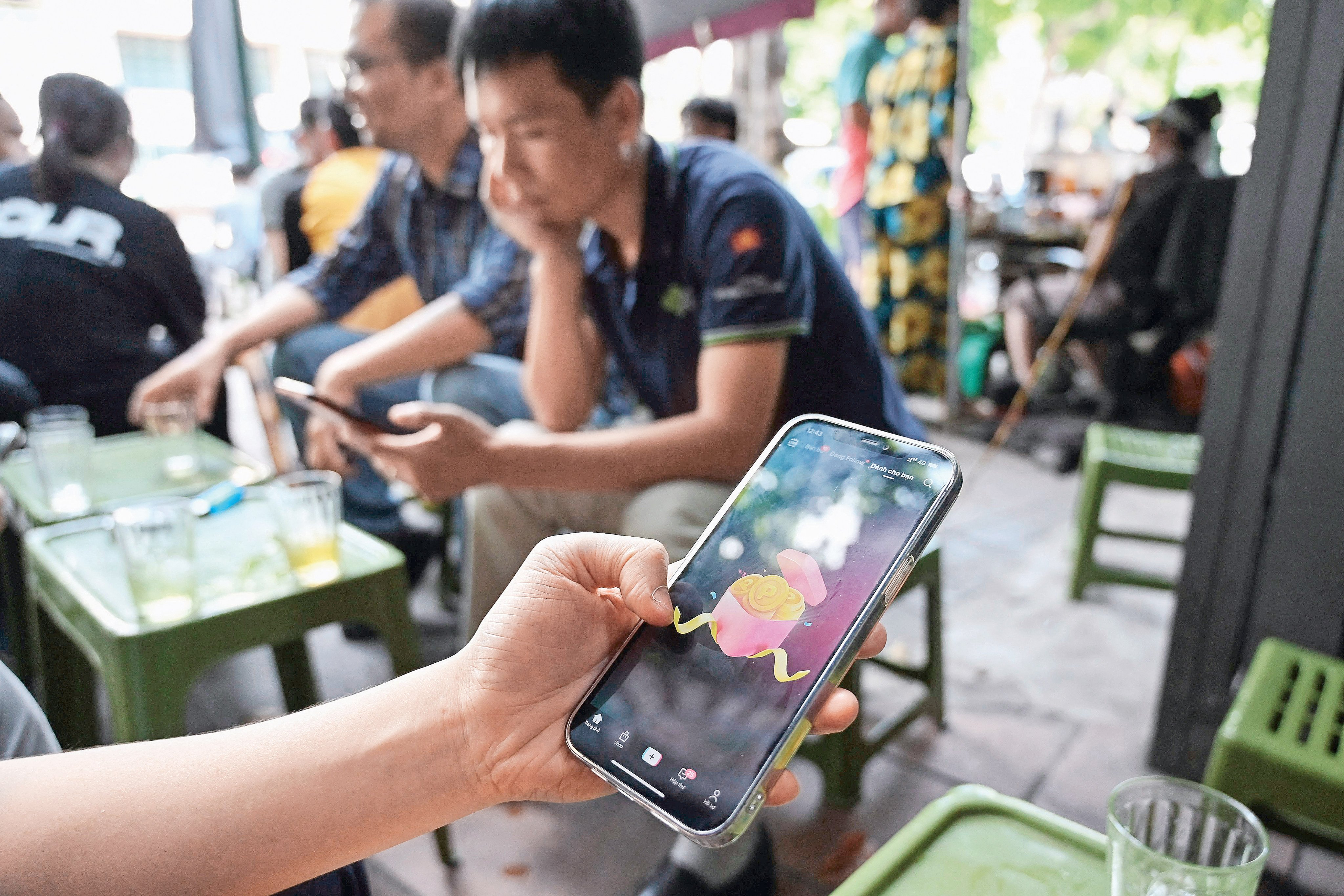 A man watches a TikTok video on his smartphone in Hanoi. Photo: AFP