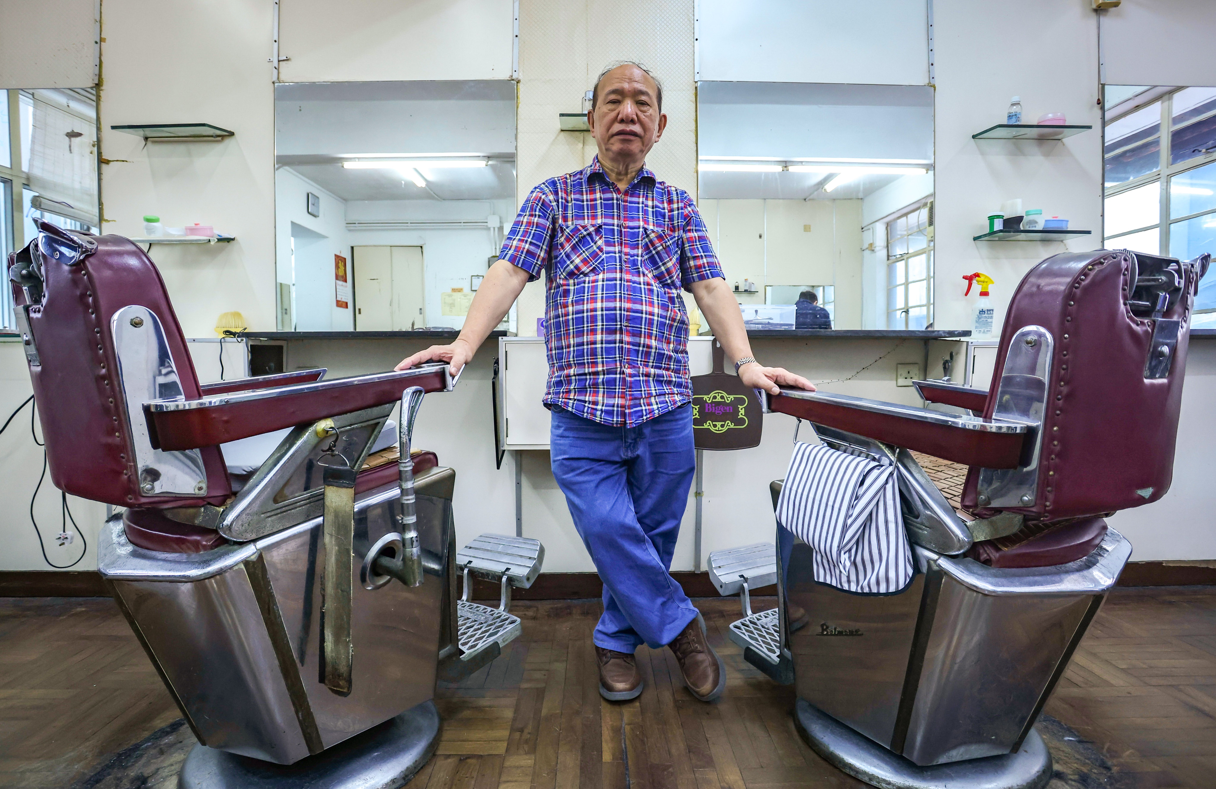 Luk Chung-yan, 78, owner of the Ambassador Barber Parlour in Causeway Bay. Photo: Jonathan Wong