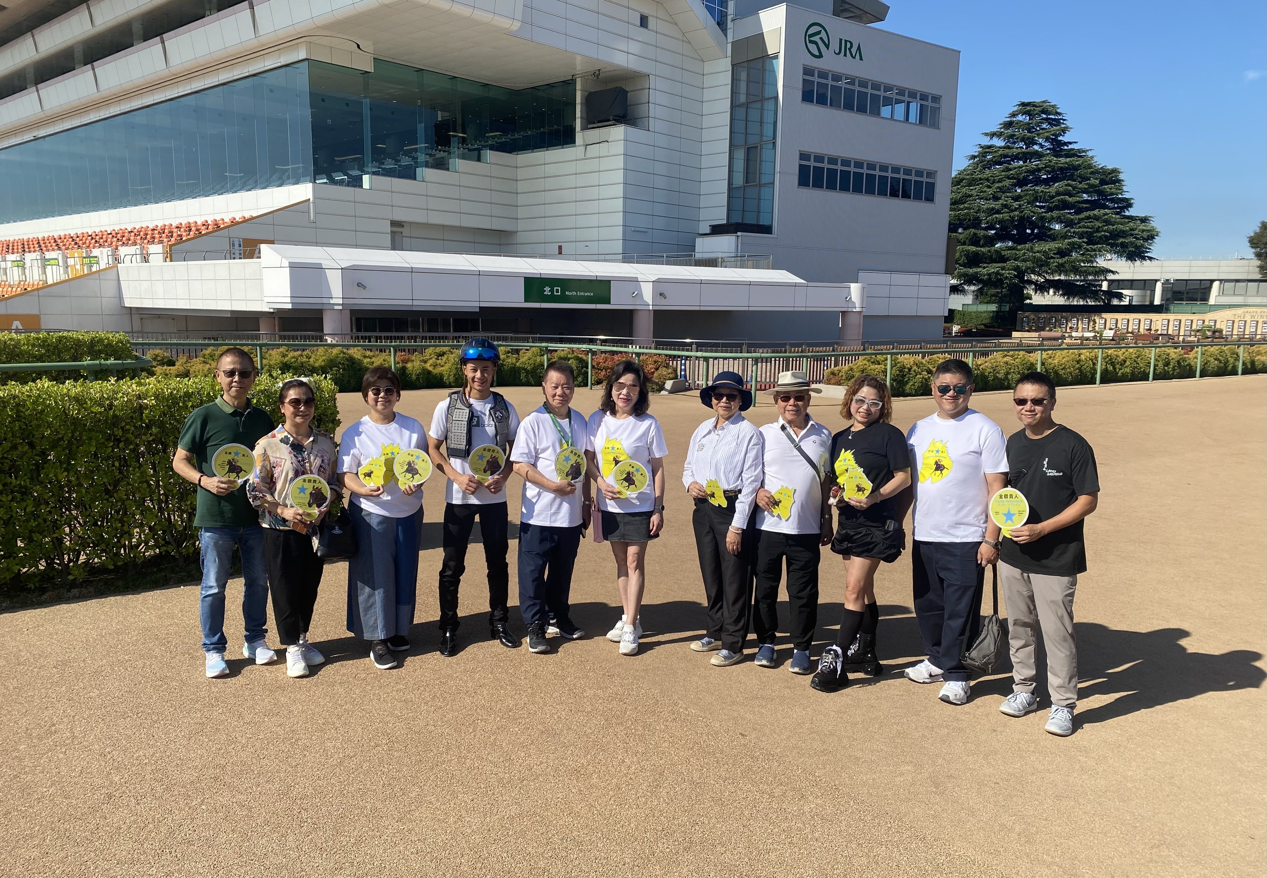 Jockey Derek Leung, trainer Manfred Man (fifth from left) and Lucky Sweynesse’s owners, the Cheng family, at Nakayama racecourse. Photo: Jay Rooney