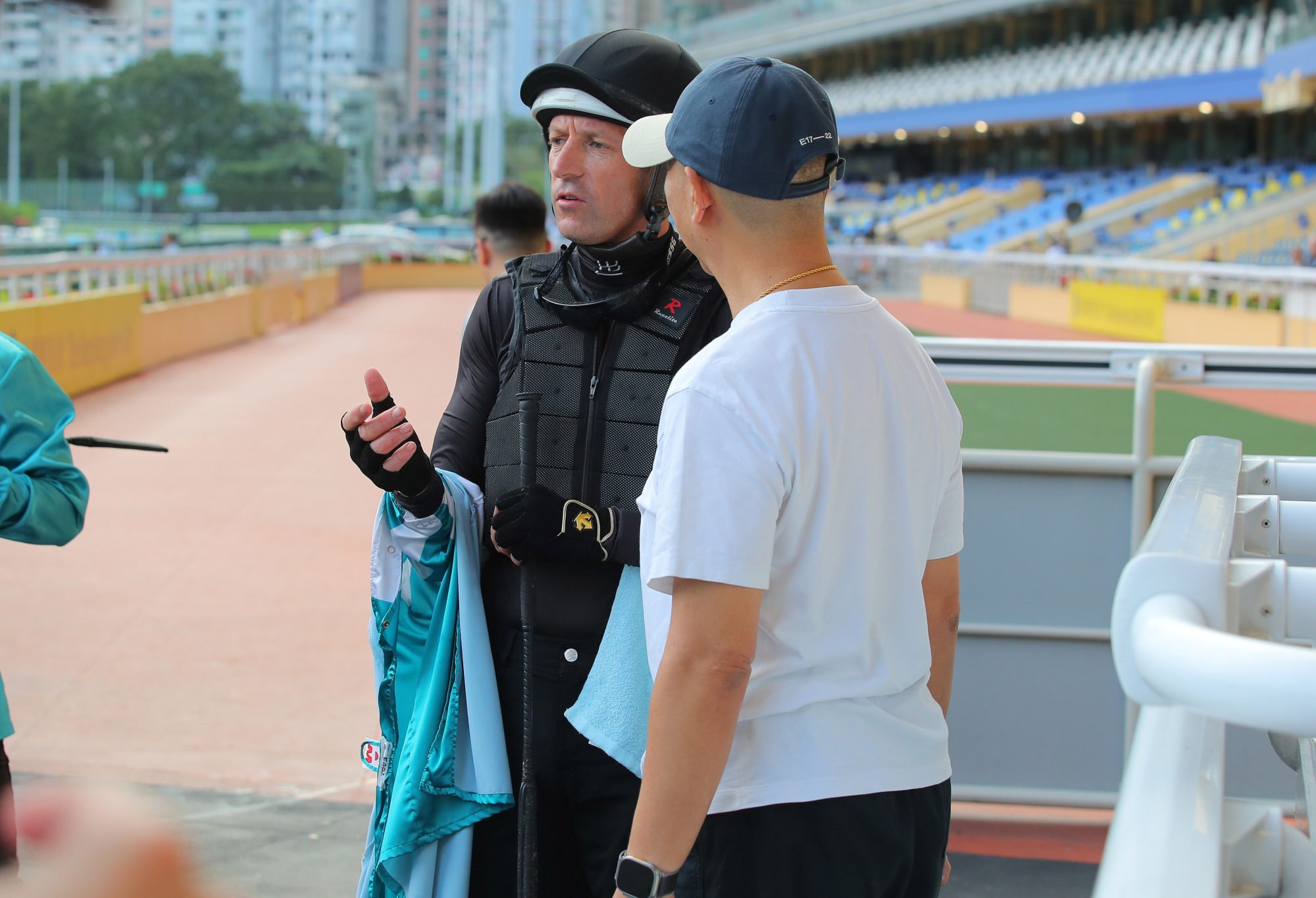 Jockey Hugh Bowman debriefs trainer Danny Shum after Romantic Warrior’s barrier trial on Saturday morning. Jockey Hugh Bowman debriefs trainer Danny Shum after Romantic Warrior’s barrier trial on Saturday morning.