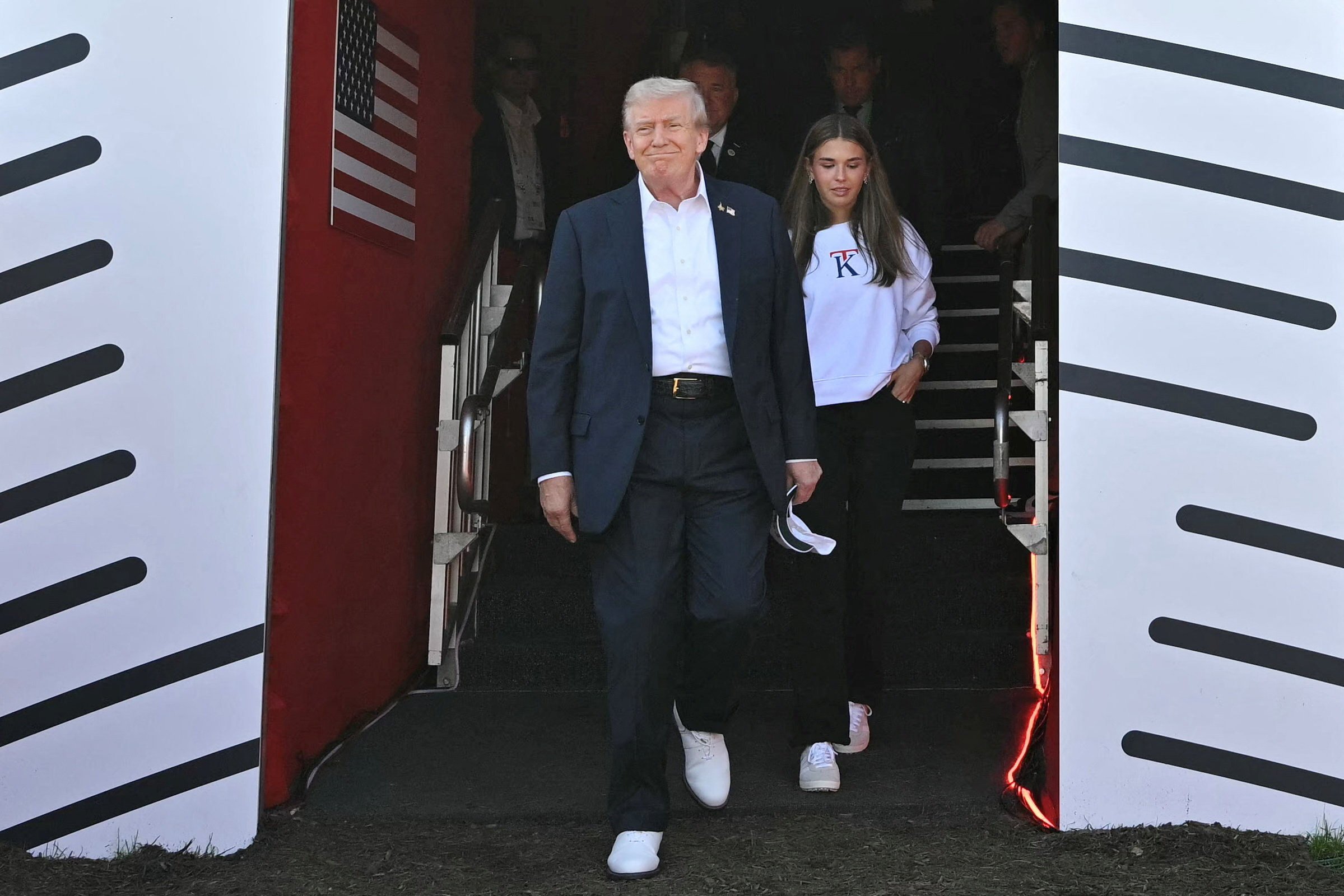 Kai Trump wears one of her sweatshirts while accompanying her grandfather, US President Donald Trump, to the Ryder Cup on Friday. Photo: Reuters