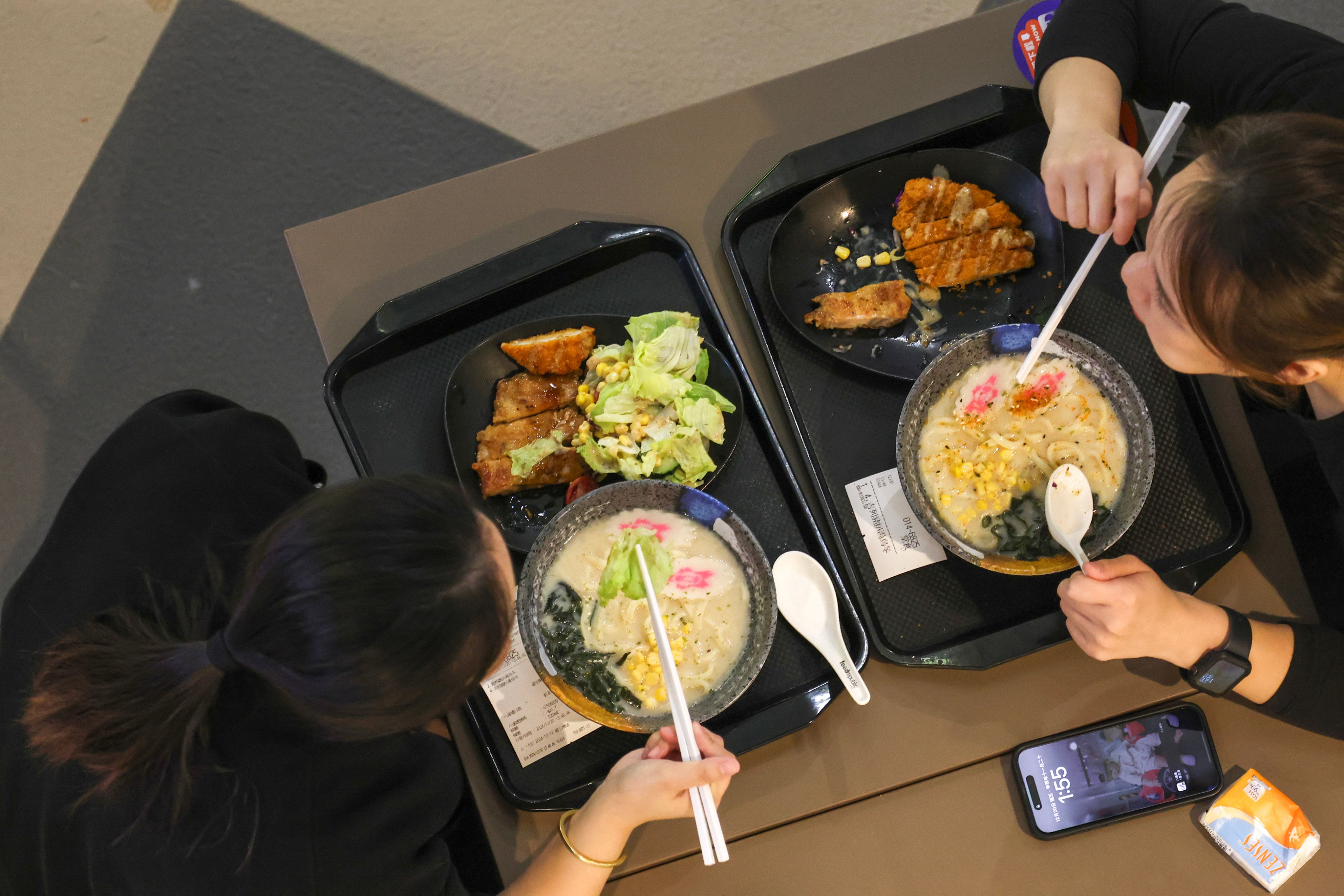 Lunchtime diners tuck into noodles at a Tsim Sha Tsui food court. Photo: Jelly Tse