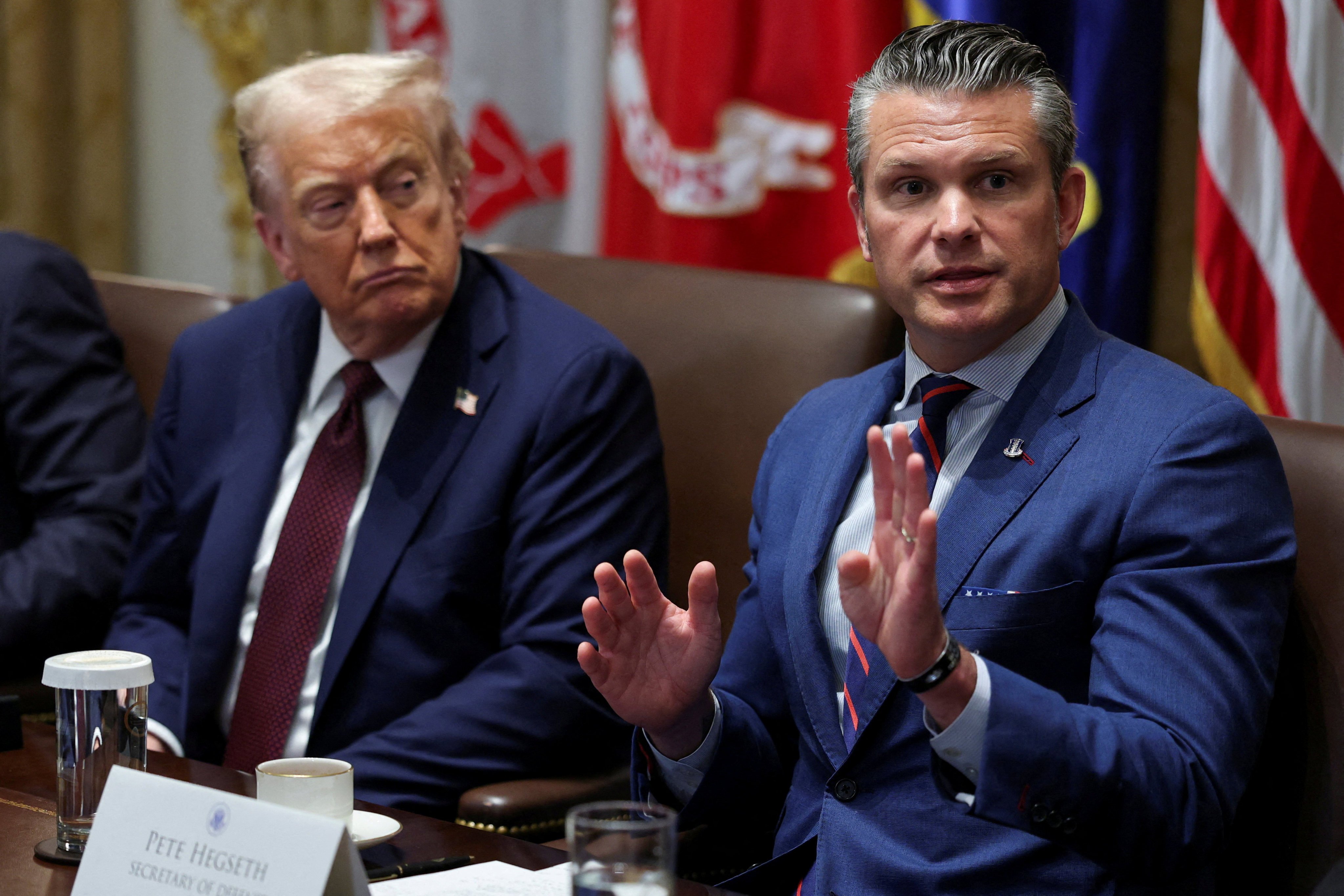 US President Donald Trump, left, and US Defence Secretary Pete Hegseth. Photo: Reuters