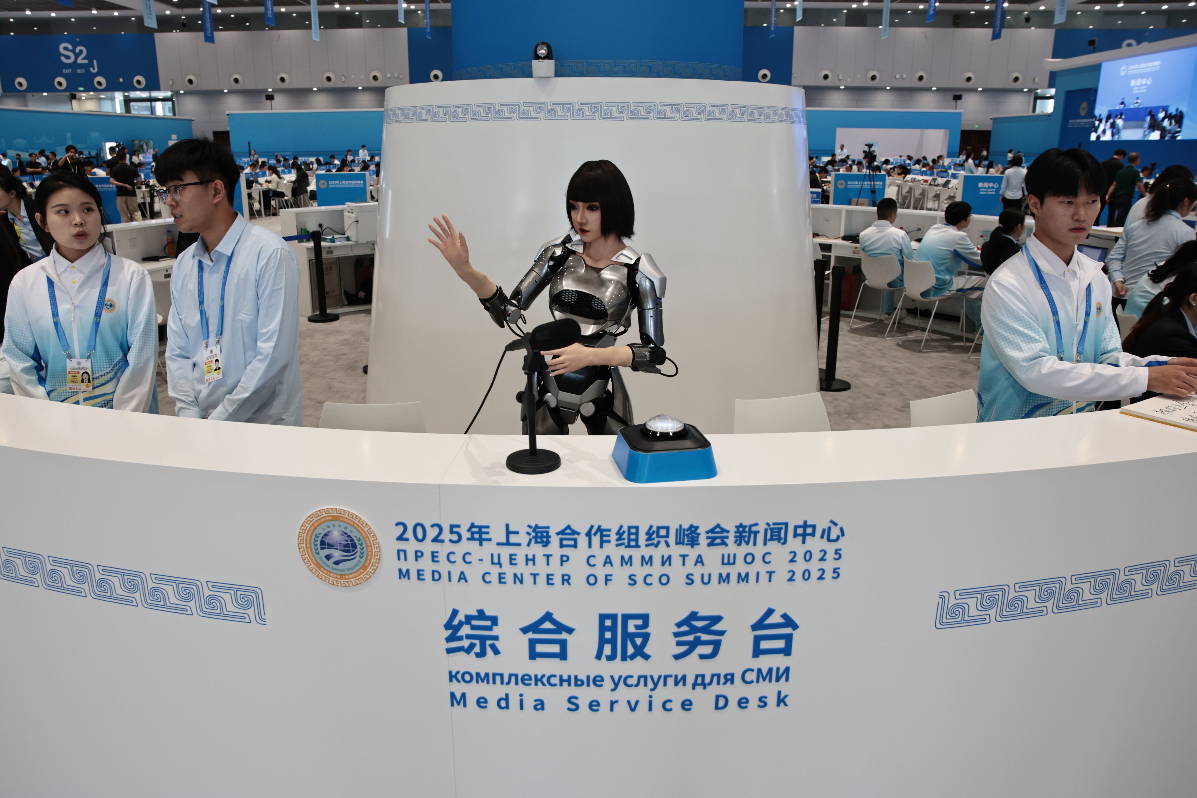 A humanoid robot gestures at the media centre of the Shanghai Cooperation Organisation summit 2025 in Tianjin, China, on August 30. Humanoid robots are being mass-produced in China at comparable quality but much lower prices than in the US. Photo: EPA