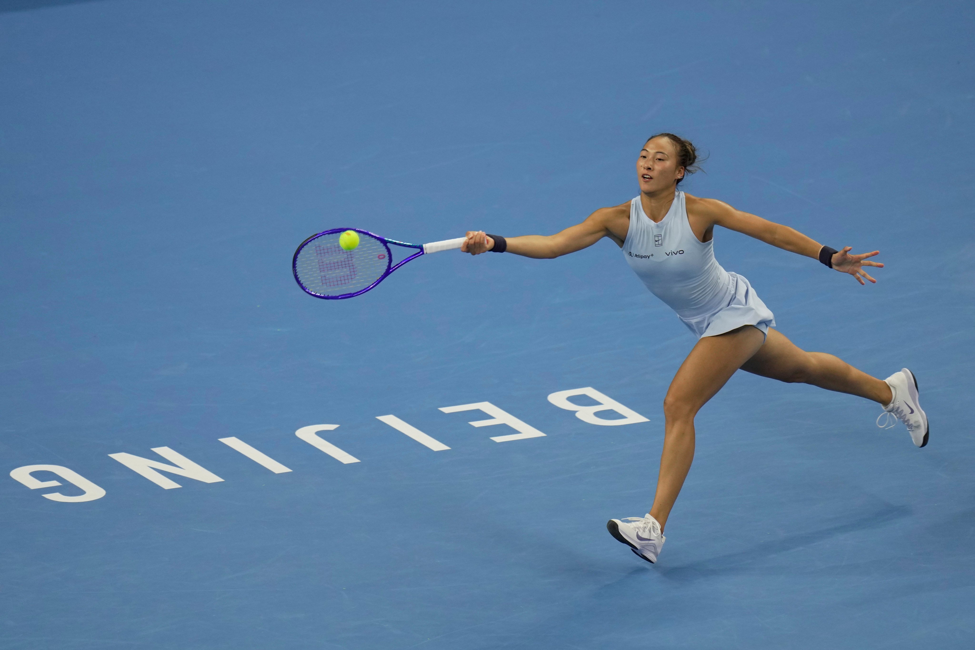 Zheng Qinwen returns a forehand shot to Linda Noskova during a women’s singles at the China Open. Photo: AP