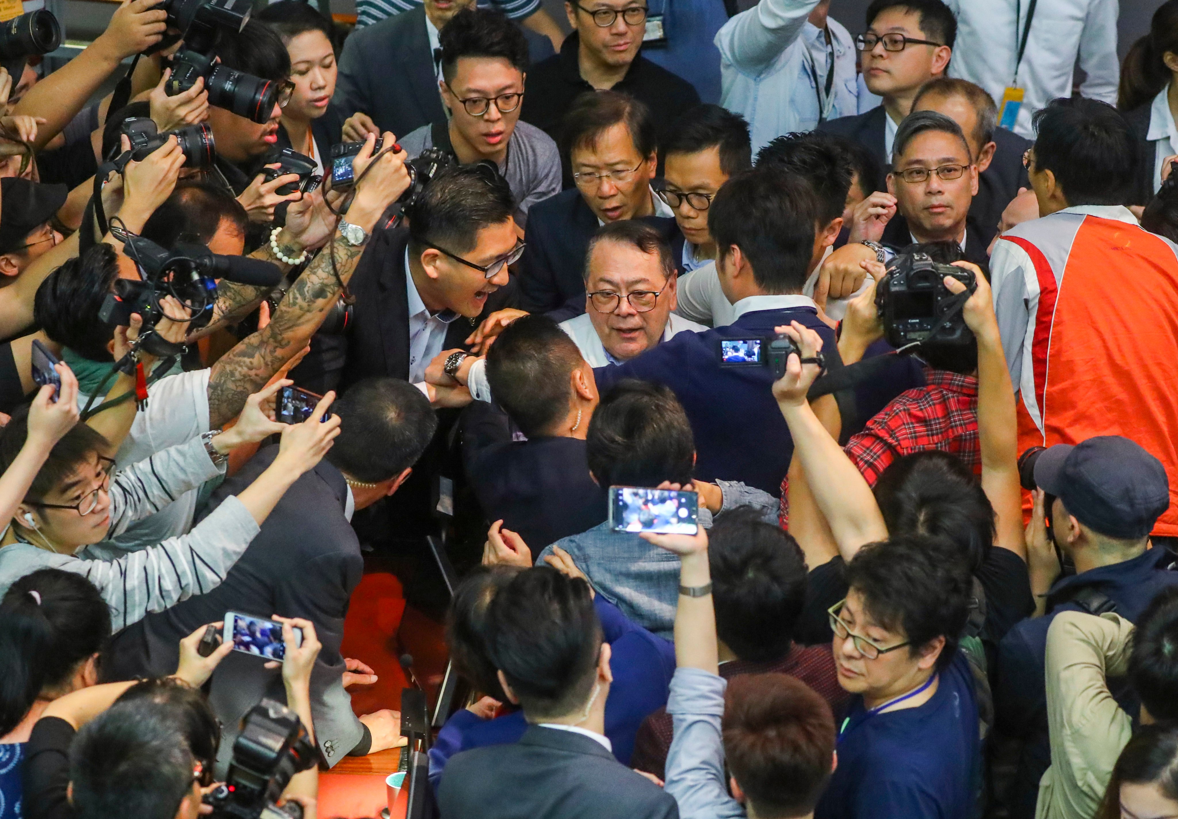 Abraham Razack (centre) is surrounded by other legislators, including Lam Cheuk-ting (left), during chaos in Legco in May 2019. Photo: Edmond So