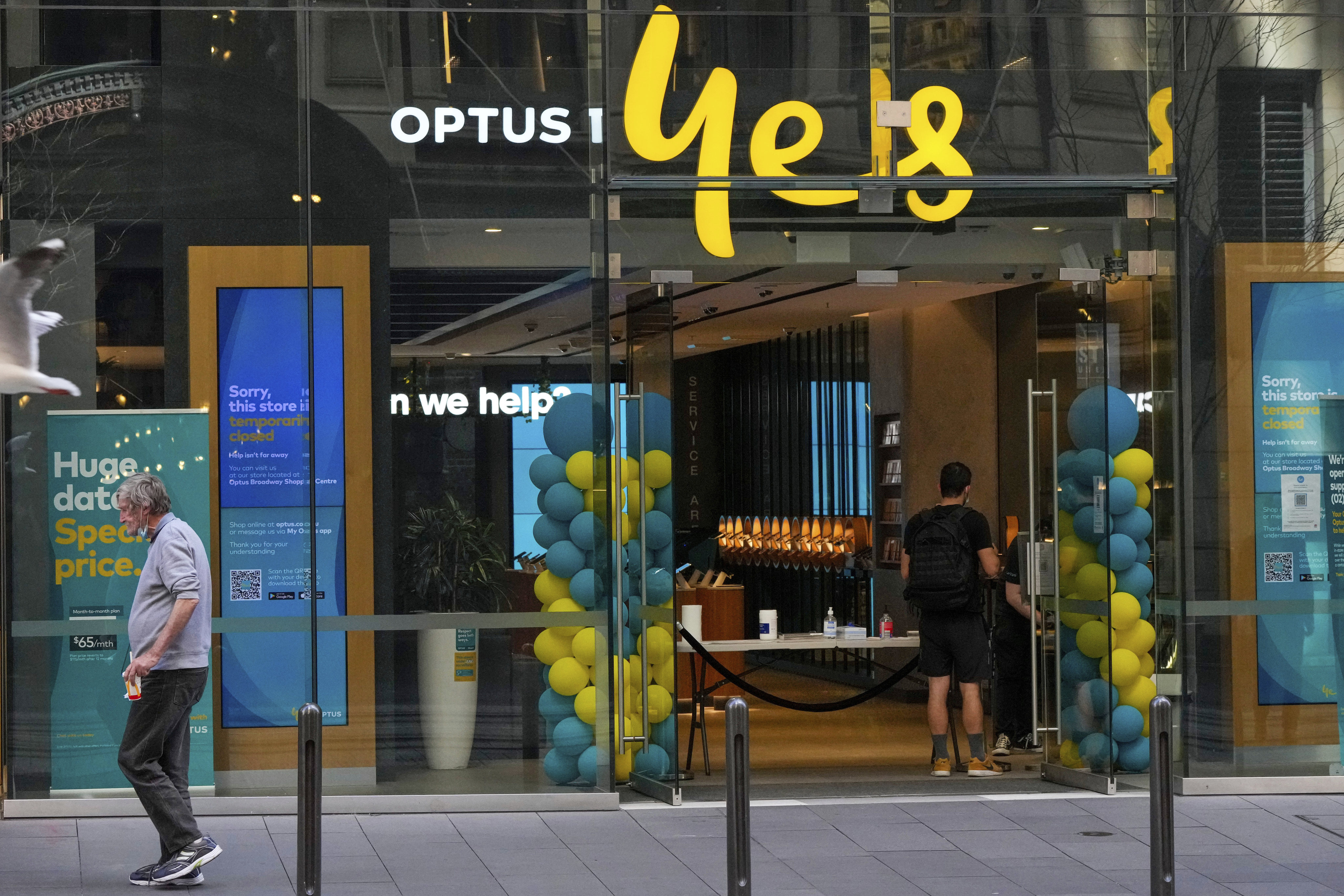 A customer waits for service at an Optus store in Sydney, Australia. Photo: AP