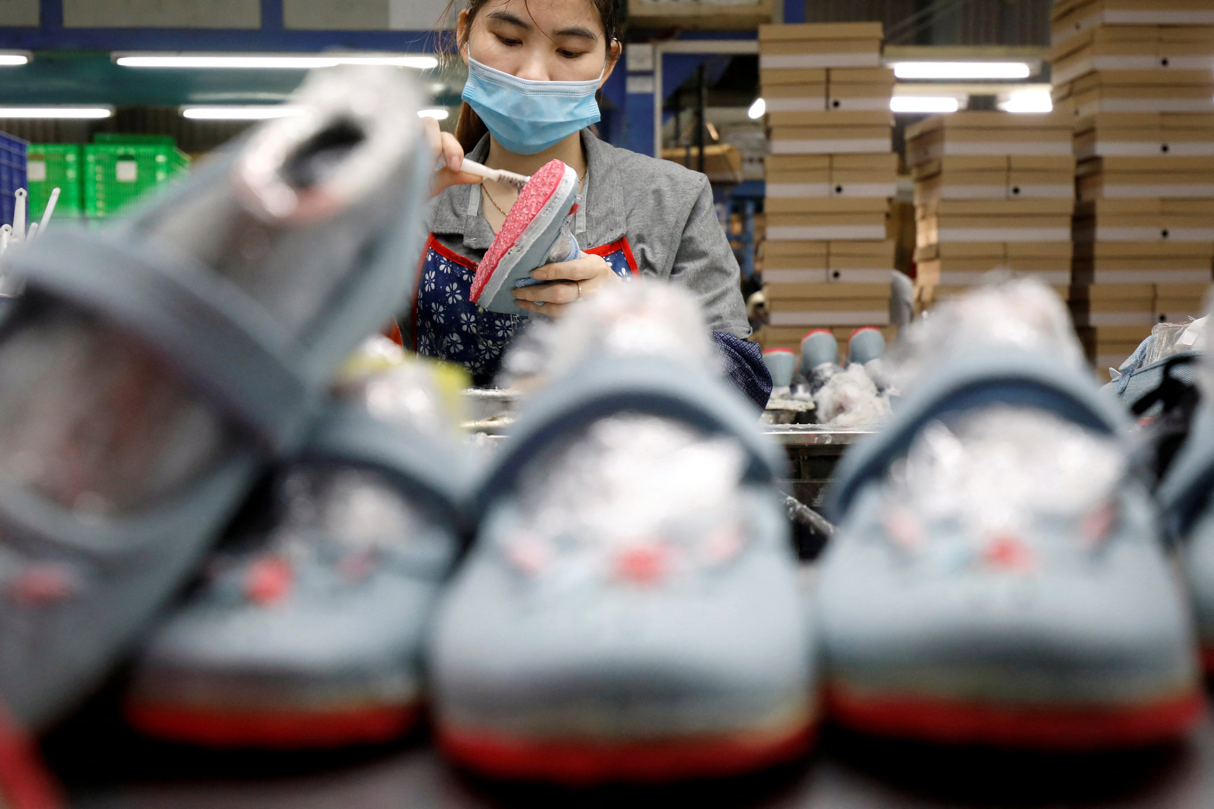 An employee works at a factory making shoes for export in Hanoi. Vietnam’s shipments to the US are projected to fall by 19.2 per cent, Photo: Reuters