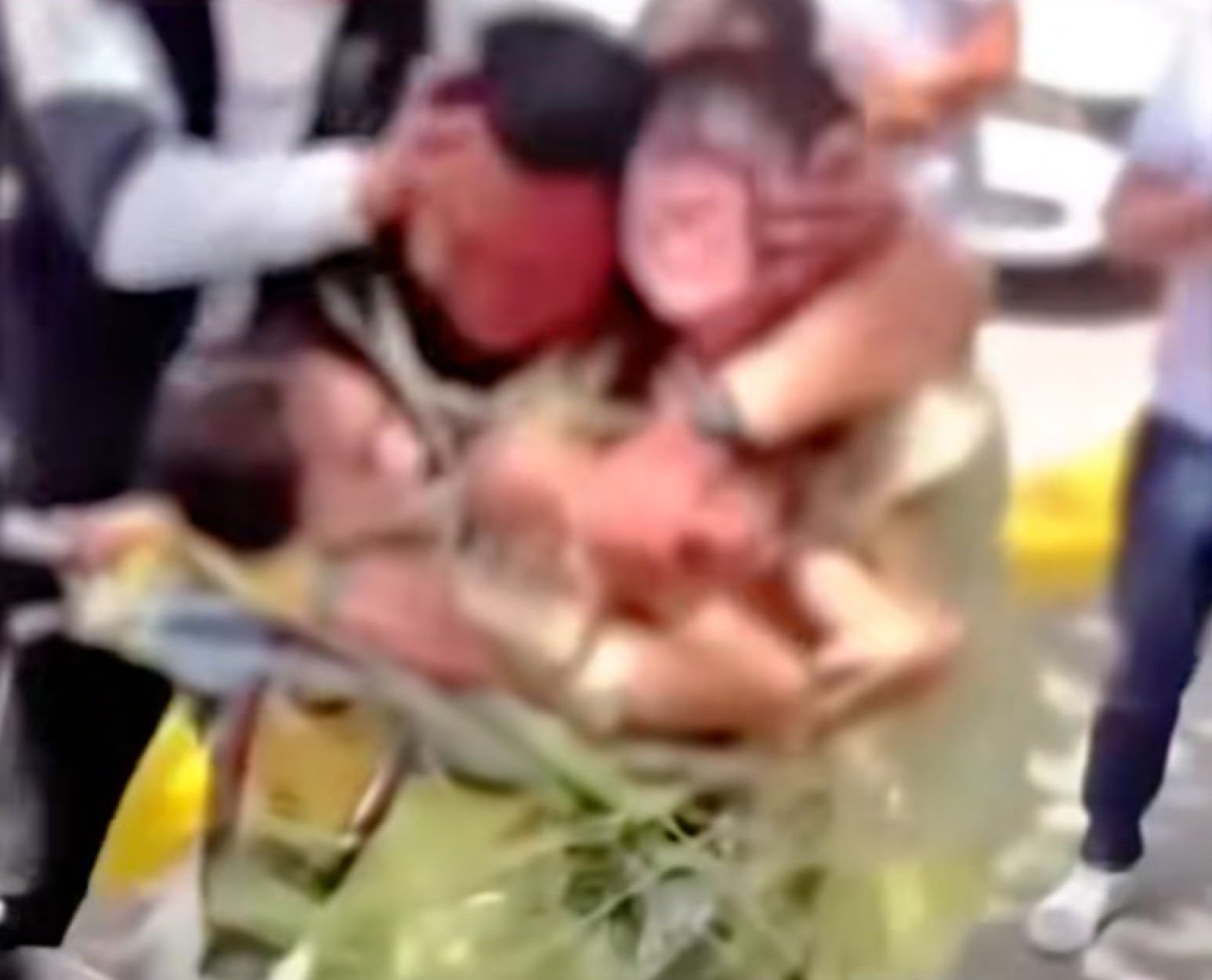 In an incident in Shaanxi province, several men taped two women to an electric bike by the roadside, with one man holding their heads down while another kissed them. Photo: Douyin In an incident in Shaanxi province, several men taped two women to an electric bike by the roadside, with one man holding their heads down while another kissed them. Photo: Douyin