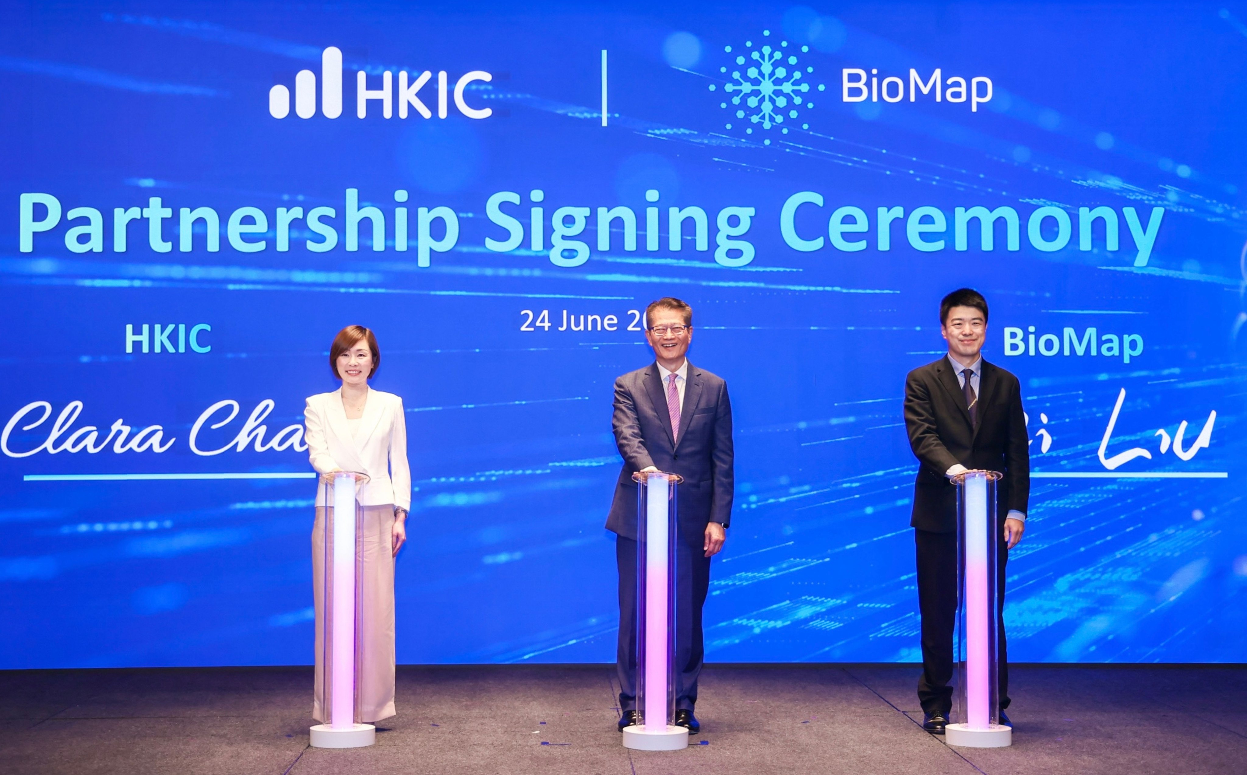 From left to right: HKIC CEO Clara Chan Ka-chai, Financial Secretary Paul Chan Mo-po and Biomap CEO Wei Liu at a signing ceremony in June. Photo: Handout