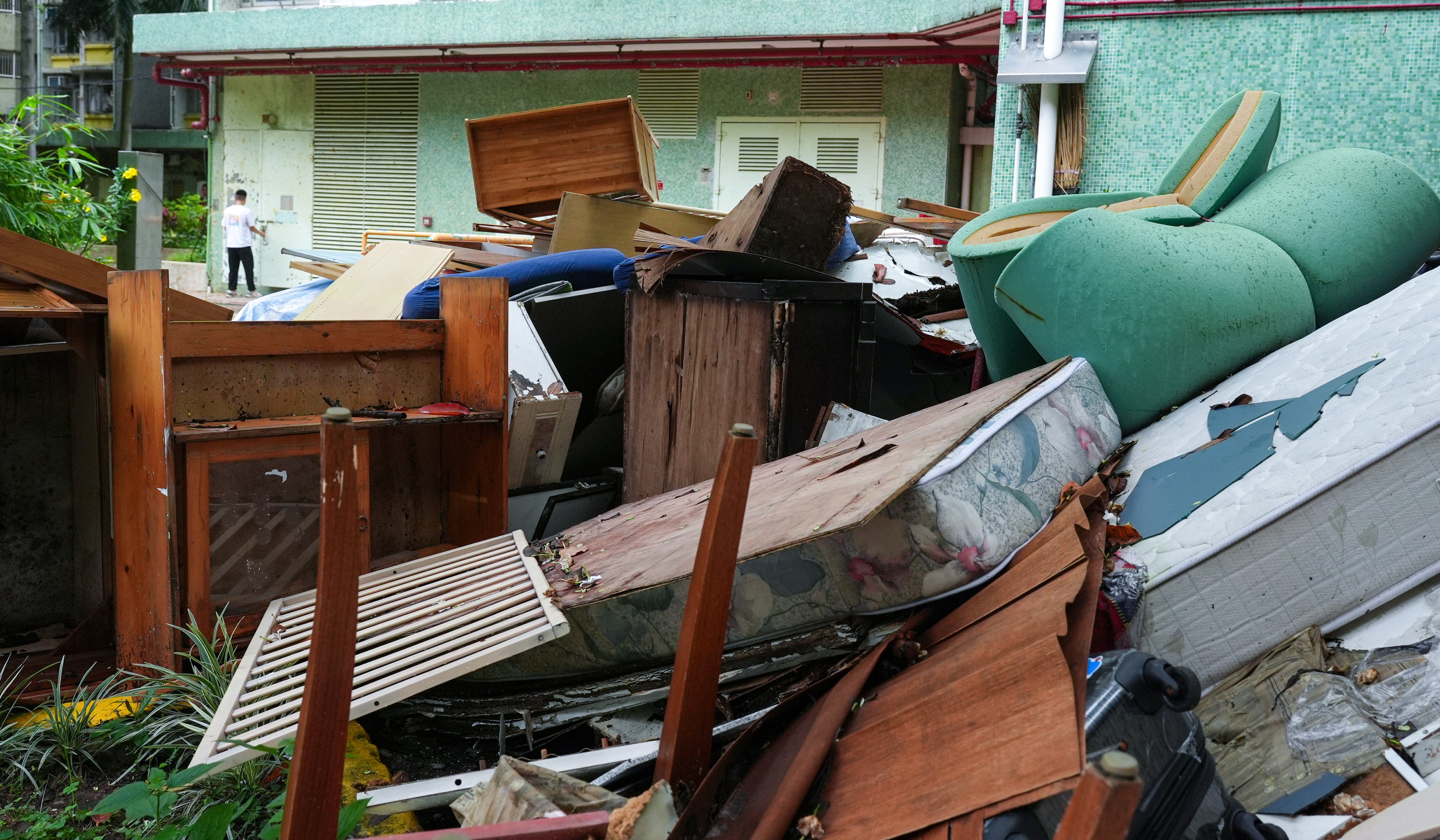 Household waste piles up at Yiu Tung Estate. The waste-charging scheme was first proposed in 2004 and passed by the legislature in 2021, before it was shelved in May last year. Photo: Eugene Lee