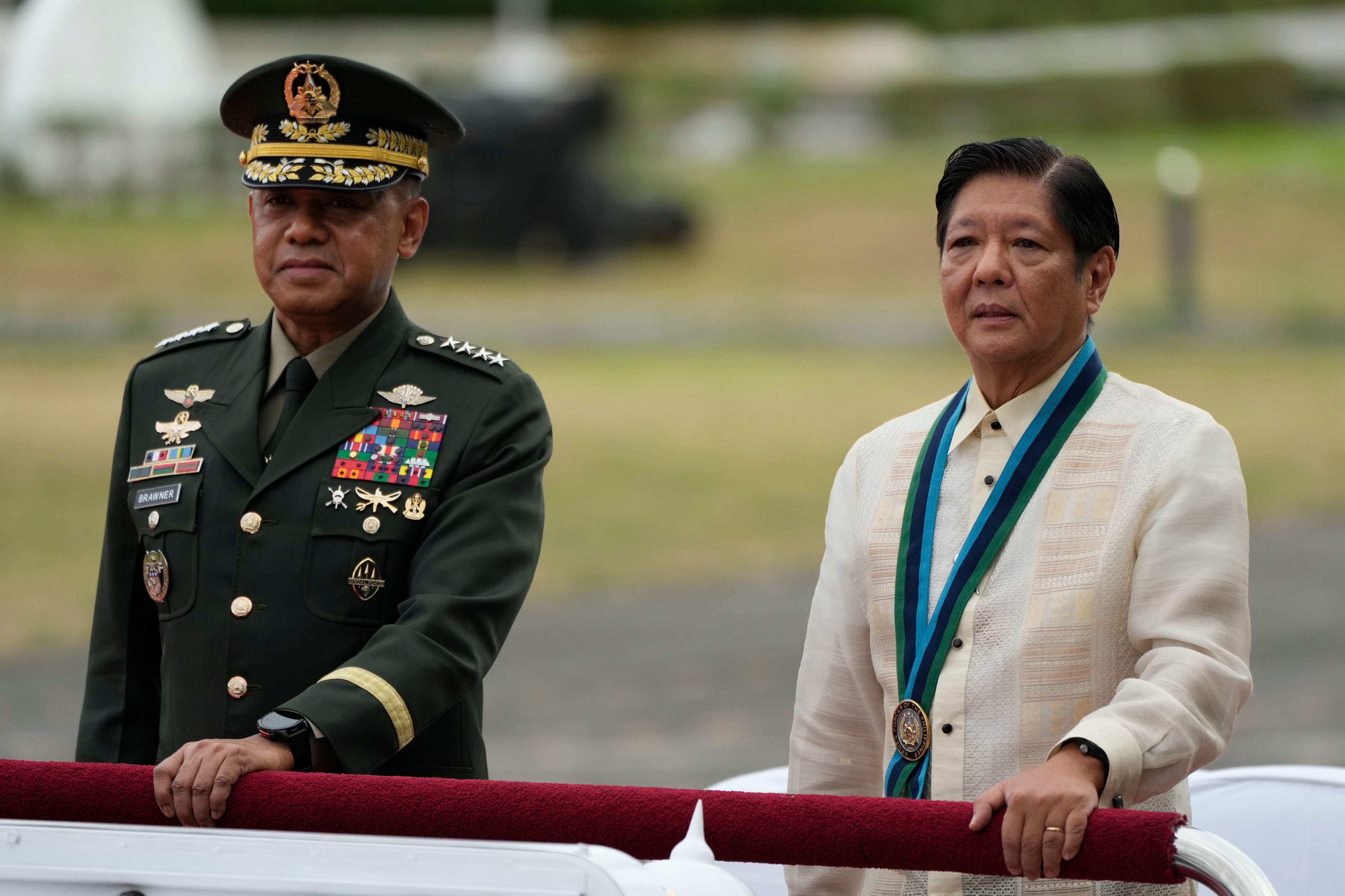 Philippine President Ferdinand Marcos Jnr (right) rides beside military chief General Romeo Brawner Jnr as he reviews troops during the 89th anniversary of the Armed Forces of the Philippines at military headquarters Camp Aguinaldo in Quezon City on December 20, 2024. Photo: AP