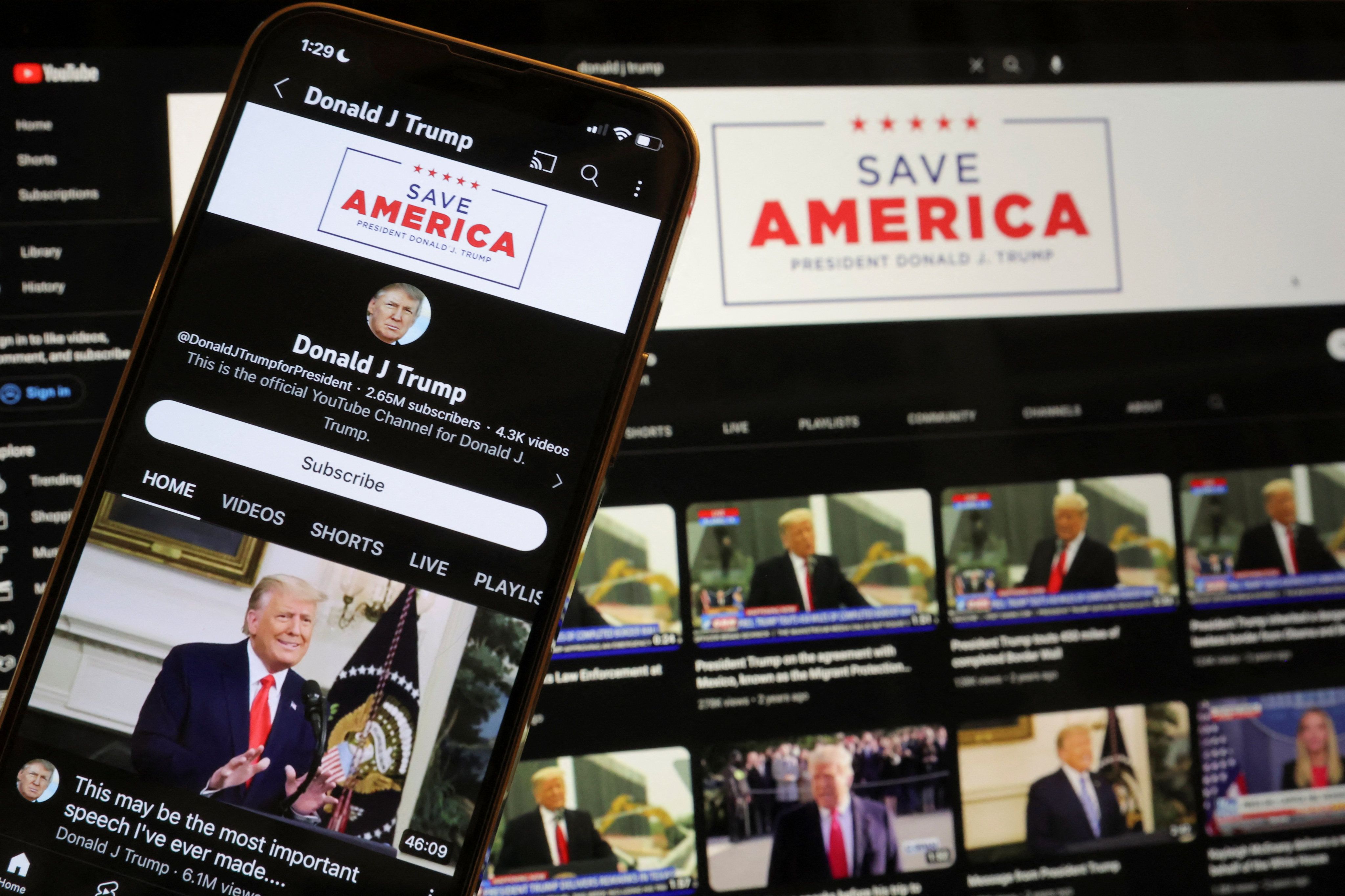 Donald Trump’s YouTube account is seen on a mobile phone and laptop in 2023 after being restored after Google lifted a suspension imposed on Trump after the January 6, 2021 Capitol riot. Photo: Reuters