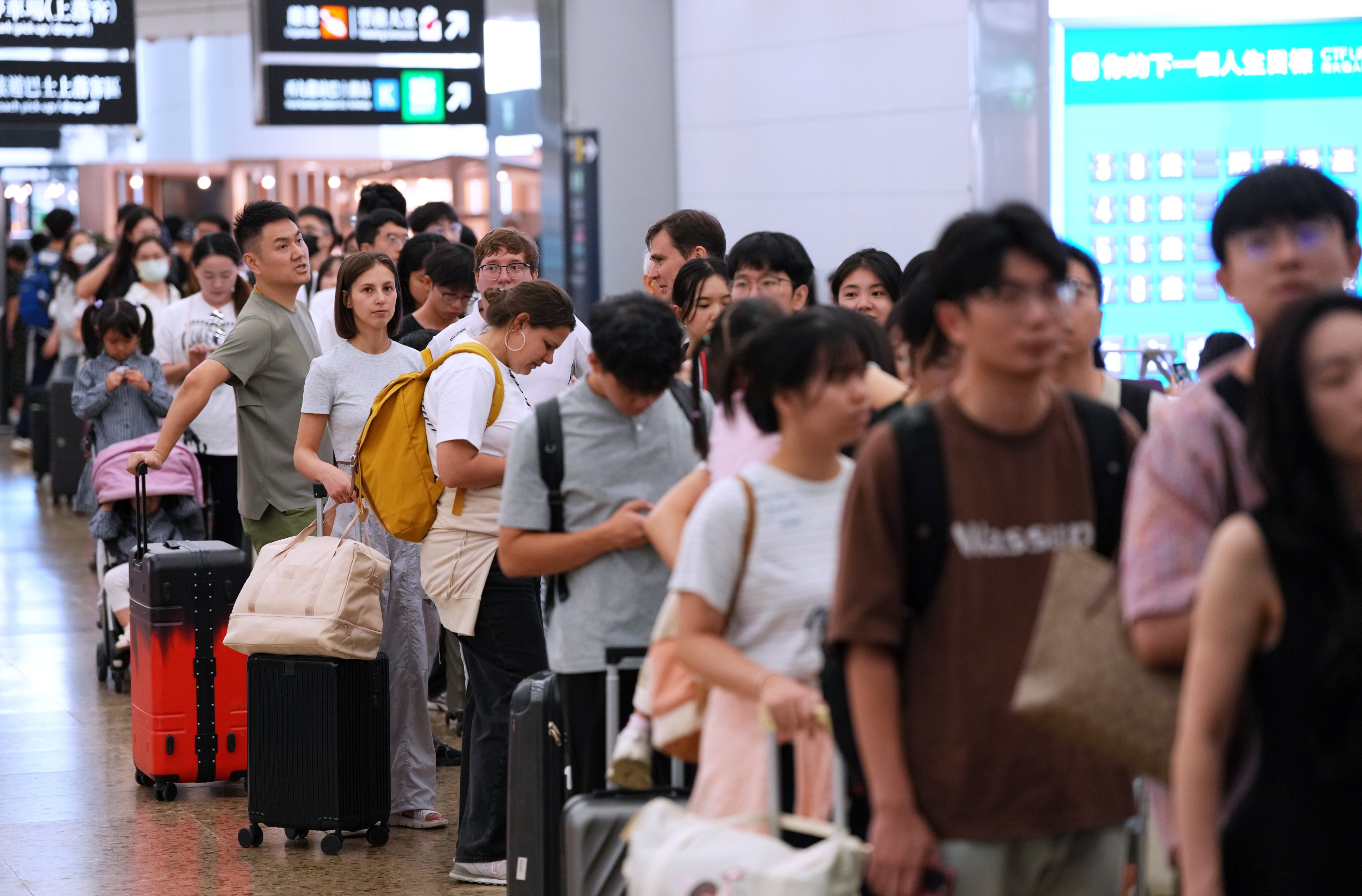 Departing travellers wait for lifts at West Kowloon station. Photo: Jelly Tse
