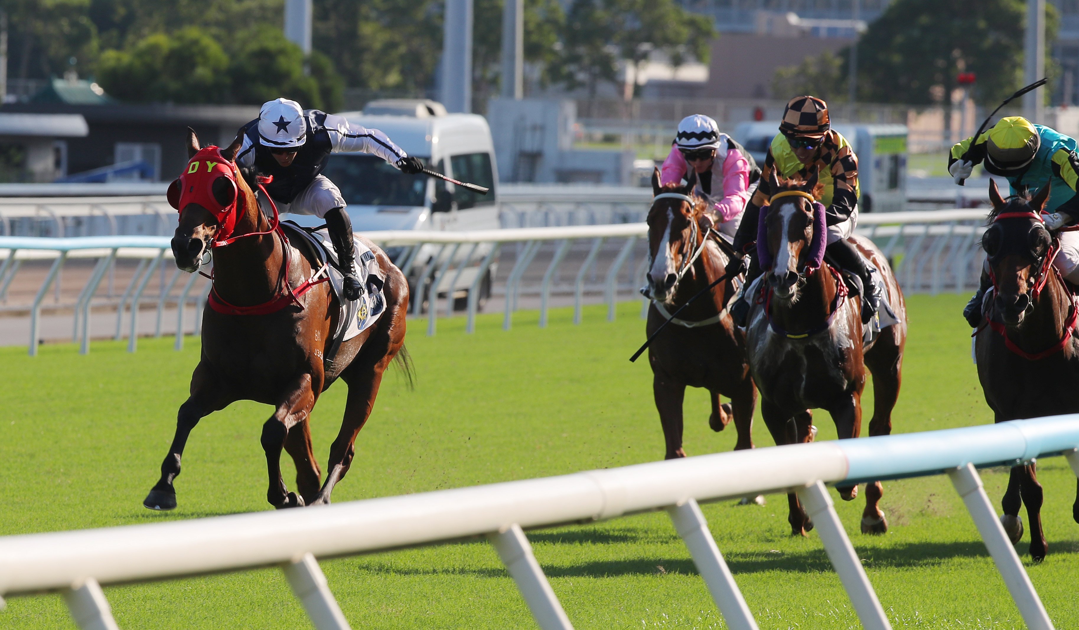 Alexis Badel lifts Fast Network (left) to victory in the National Day Cup. Photos: Kenneth Chan