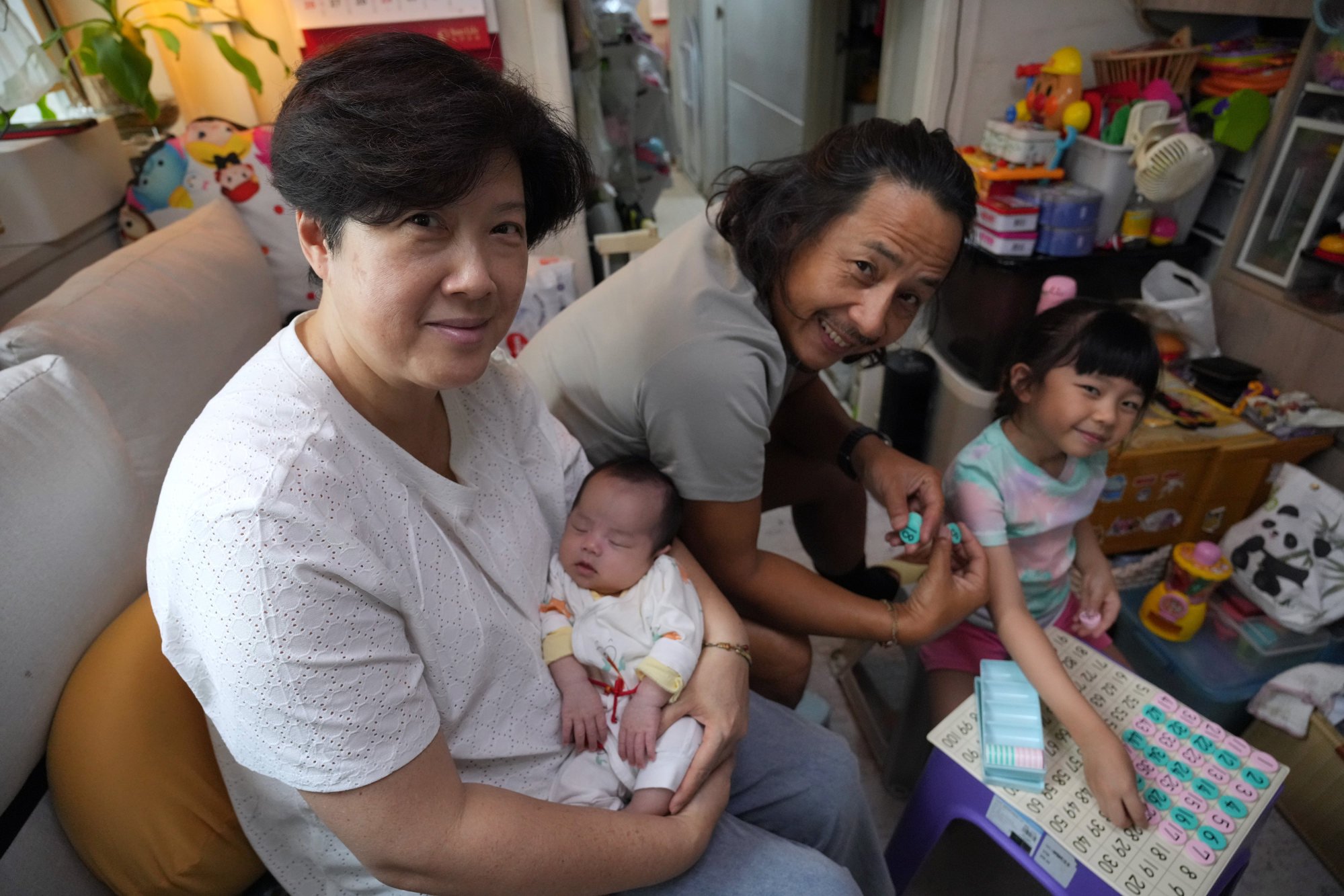 The happy family at their home in Tuen Mun. Photo: May Tse