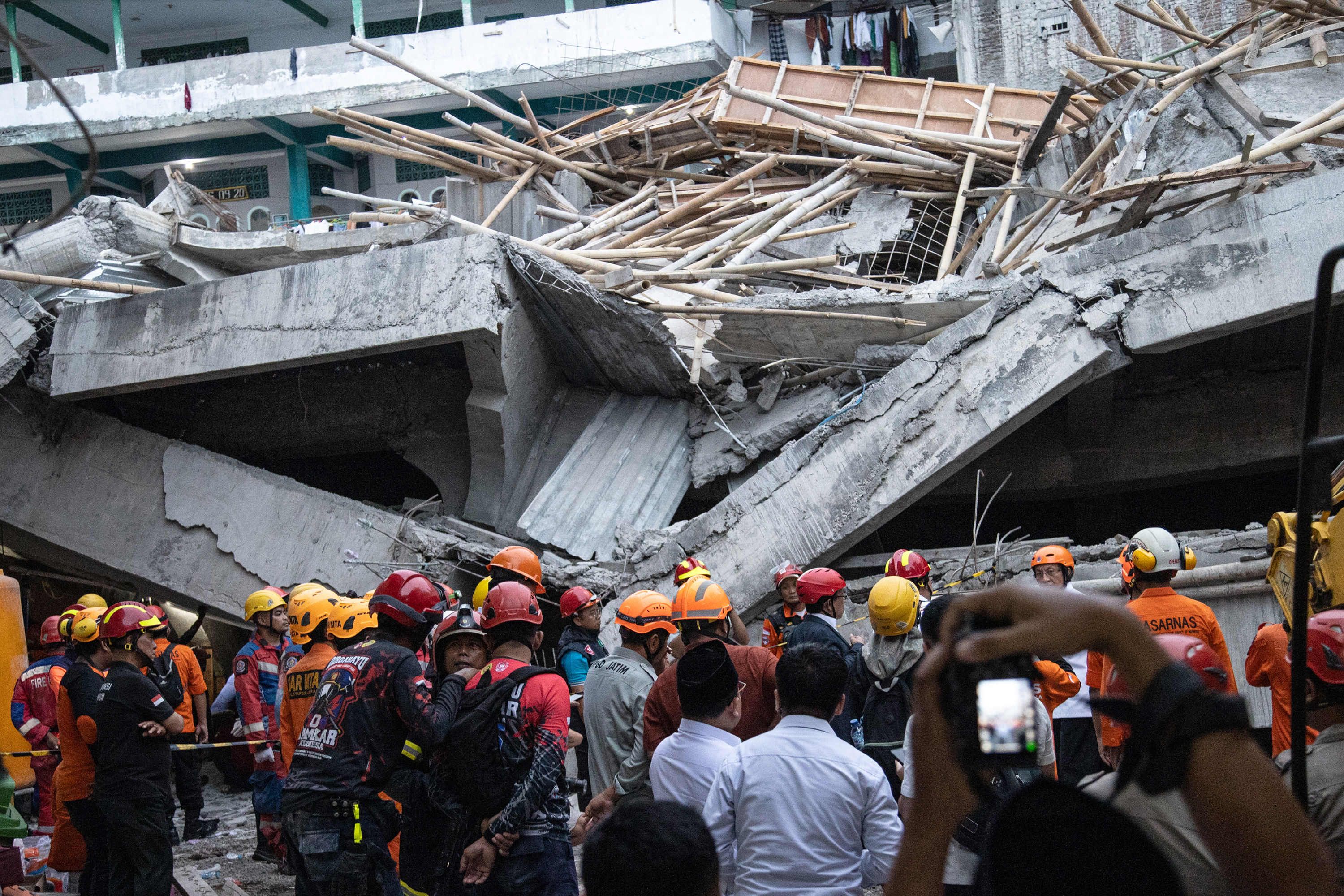 Rescuers search for survivors in the rubble of a collapsed building at Al Khoziny Islamic Boarding School in Sidoarjo on Tuesday. Photo: Getty Images/TNS