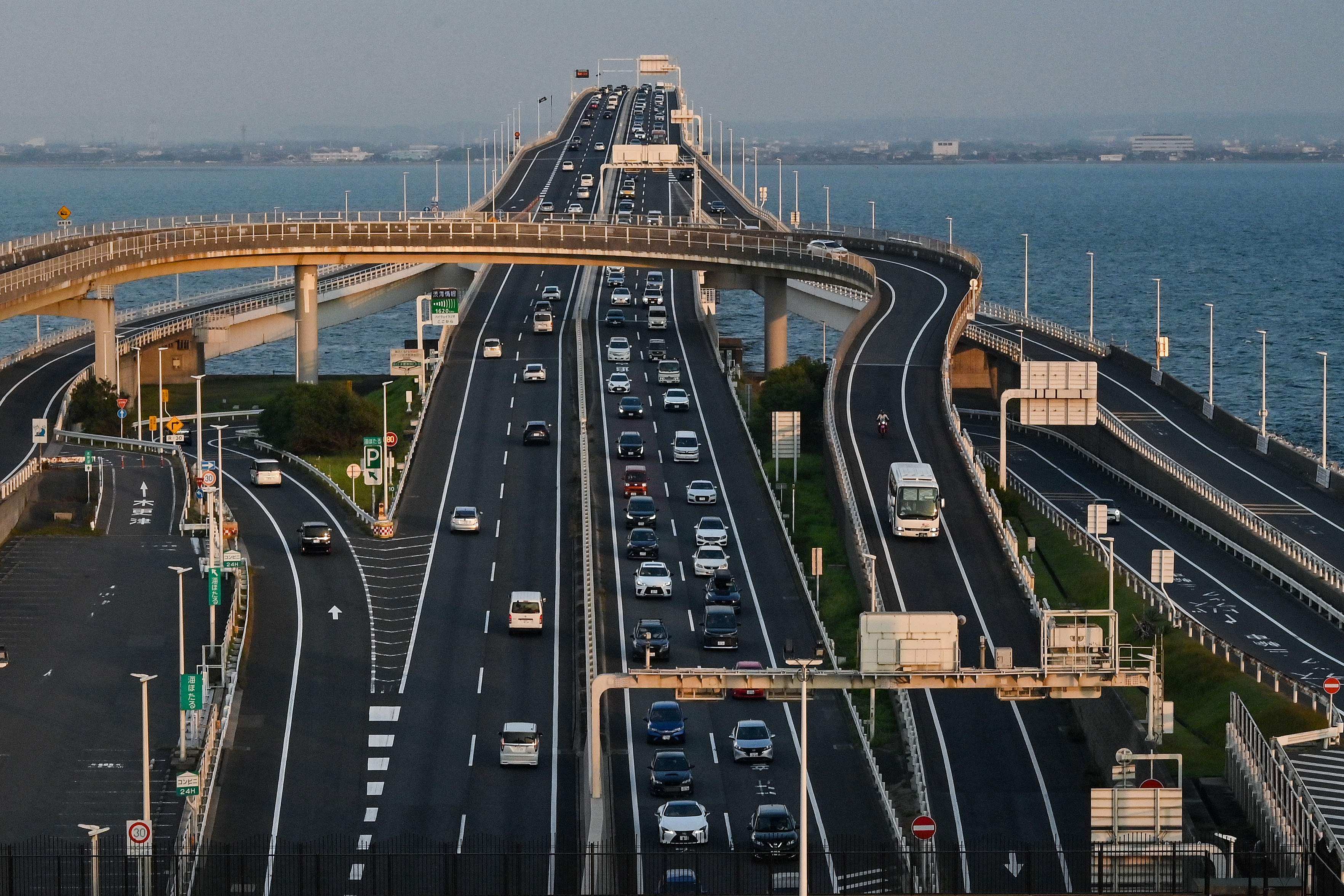 Cars travel from a bridge into the tunnel section entrance at Umihotaru, a man-made island designed as a parking area. Photo: AFP