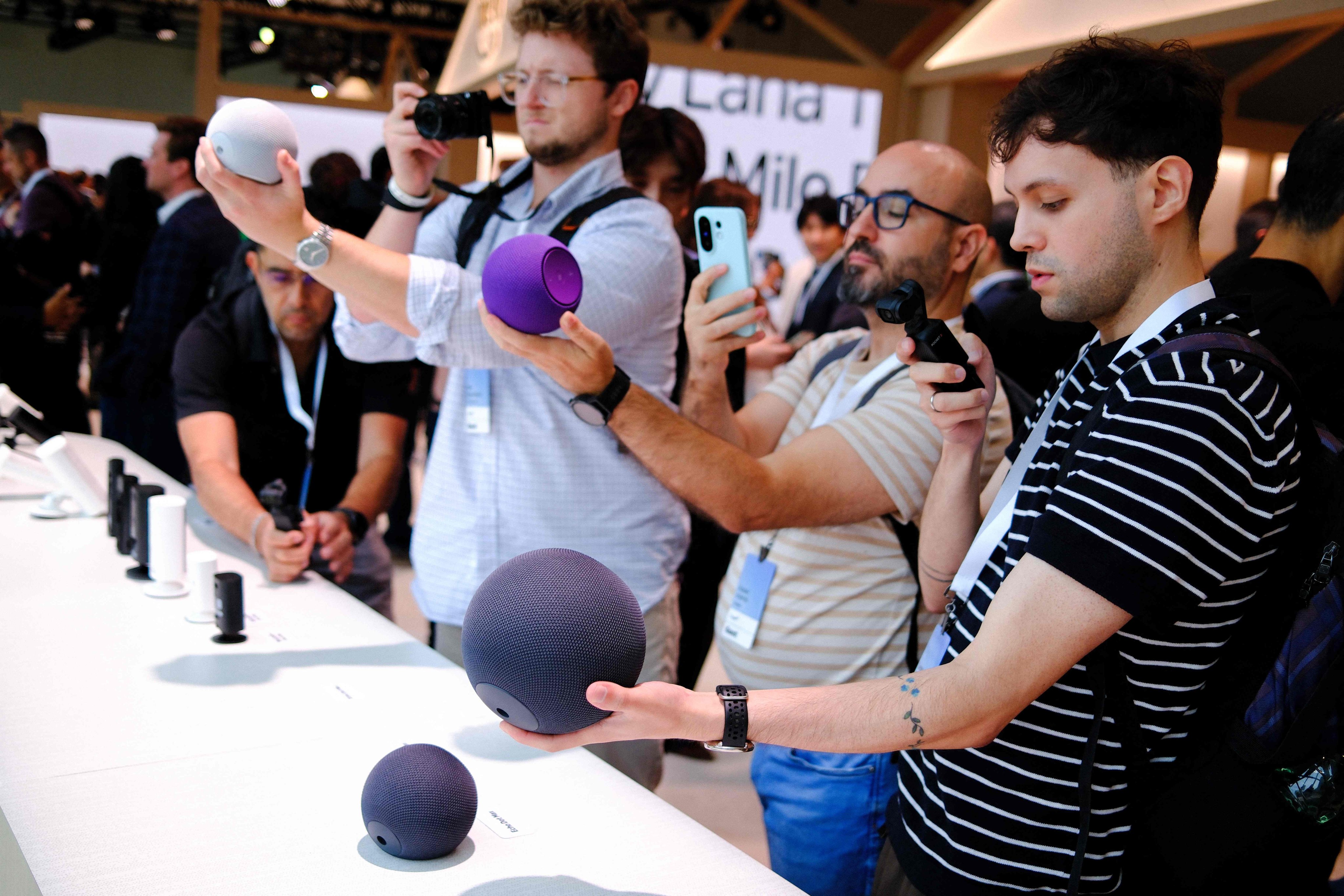 Guests take pictures of Amazon Echo smart speakers during an Amazon product event in New York on September 30, 2025, at which Amazon announced its next generation of Kindle, Ring, Blink, Fire TV and Echo devices. Photo: AFP