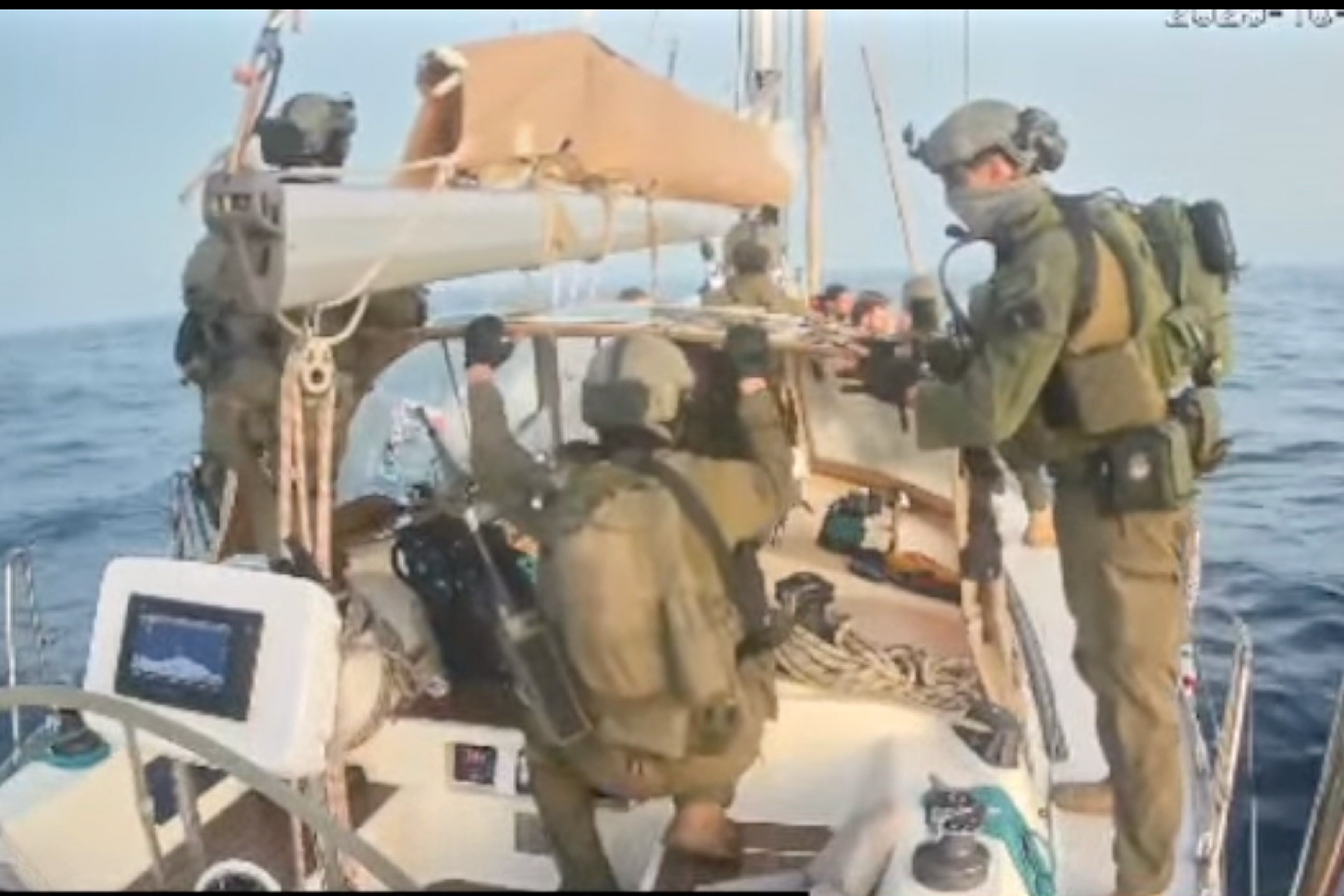 Israeli navy forces aboard one of the flotilla’s vessels after it was intercepted. Photo: Global Sumud Flotilla via AP