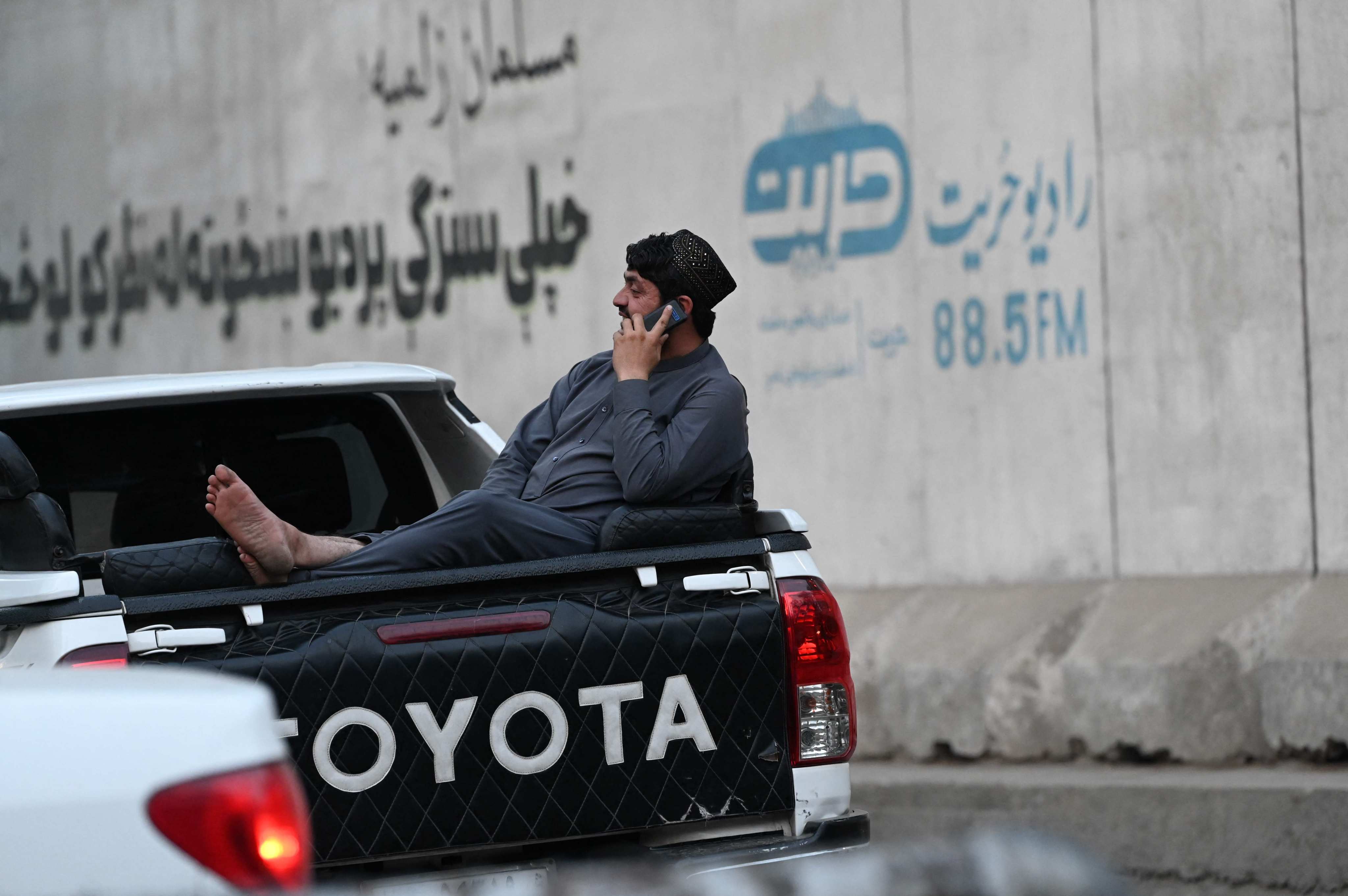 An Afghan man speaks on a mobile phone in Kabul on Wednesday. Photo: AFP