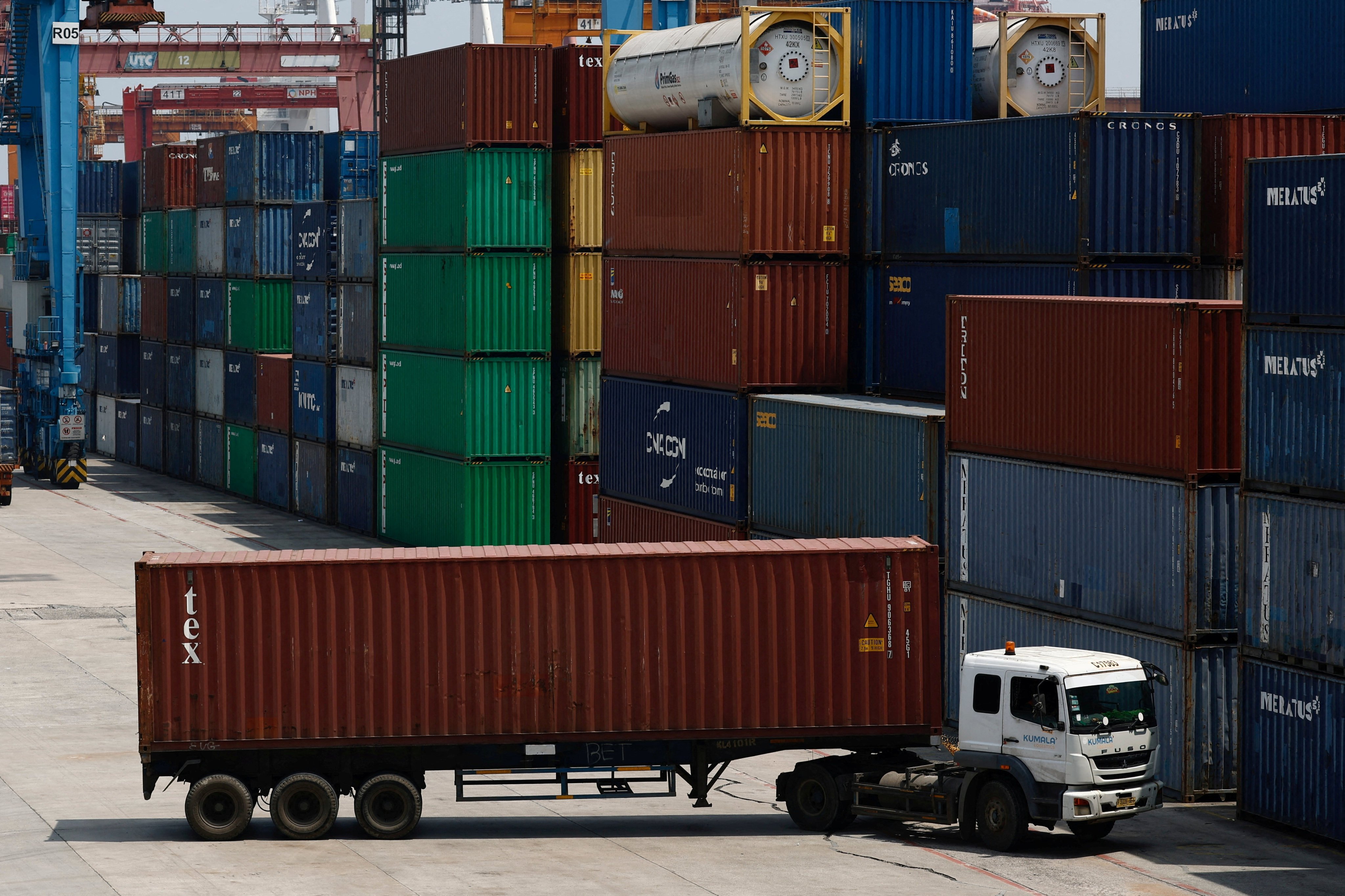 A truck drives near stacks of containers at Tanjung Priok Port in Jakarta, Indonesia, in February. Photo: Reuters