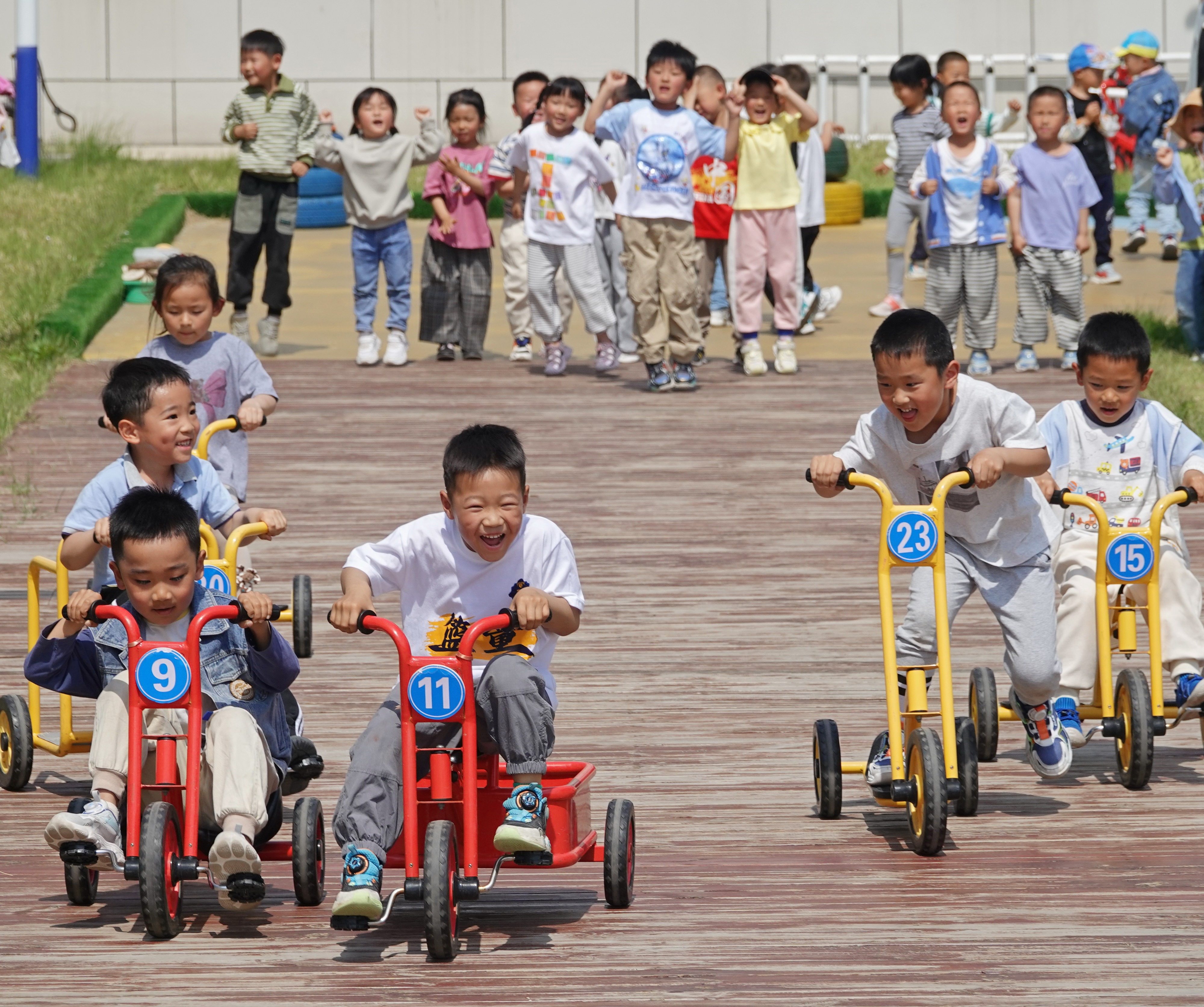 Children take part in a bicycle race at the Second Experimental Kindergarten in Yantai High-tech Zone, Shandong province in 2024. Photo: CFOTO / Future Publishing via Getty Images