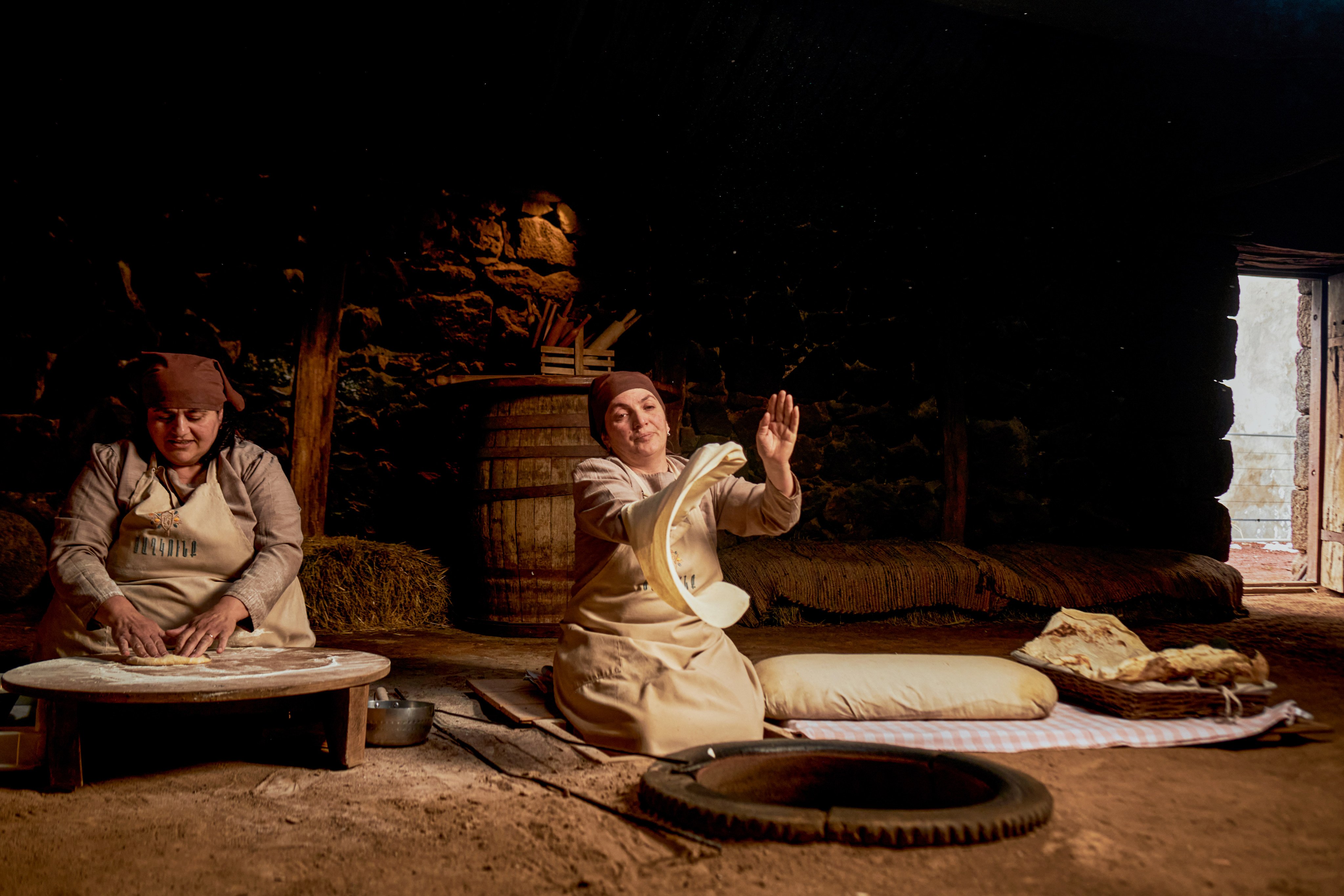 Anna Yesayan (left) and Gohar Gareginyan making lavash bread in a glkhatun dwelling in the Armenian village of Tsaghkunk. Photo: courtesy Tsaghkunk Restaurant & Glkhatun
