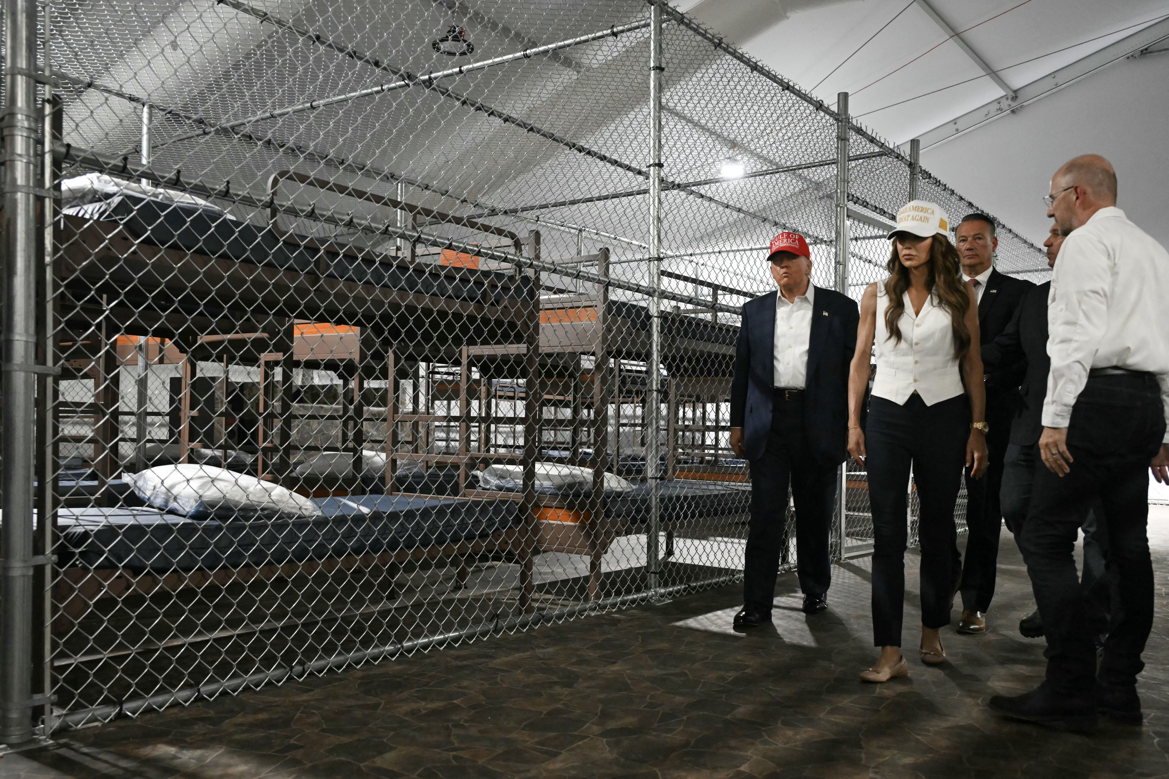 US President President Donald Trump (left) and US Secretary of Homeland Security Kristi Noem (second from left) tour a migrant detention center, dubbed “Alligator Alcatraz”, in Ochopee, Florida, on July 1. Photo: AFP/Getty Images/TNS