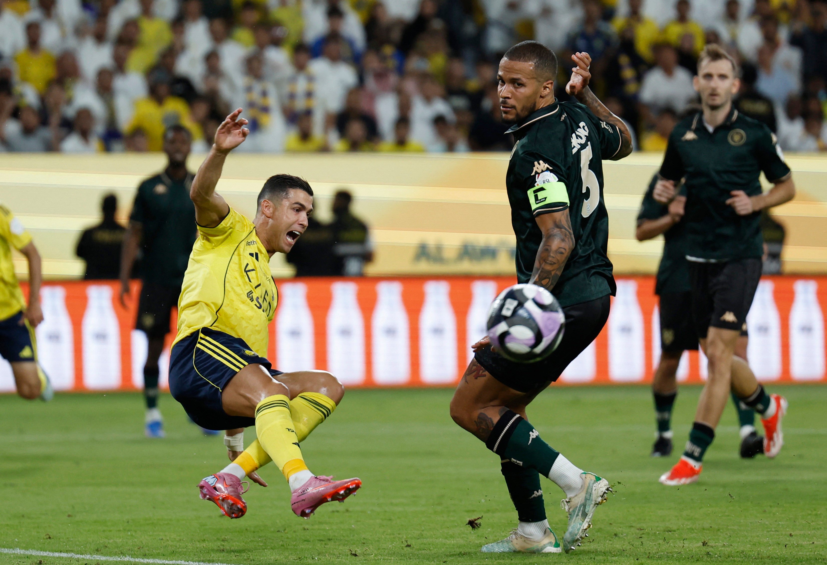 Al-Kholood’s William Troost-Ekong (right) tussles with Al-Nassr’s Portuguese forward Cristiano Ronaldo, one of the Saudi Pro League’s biggest stars. Photo: Reuters