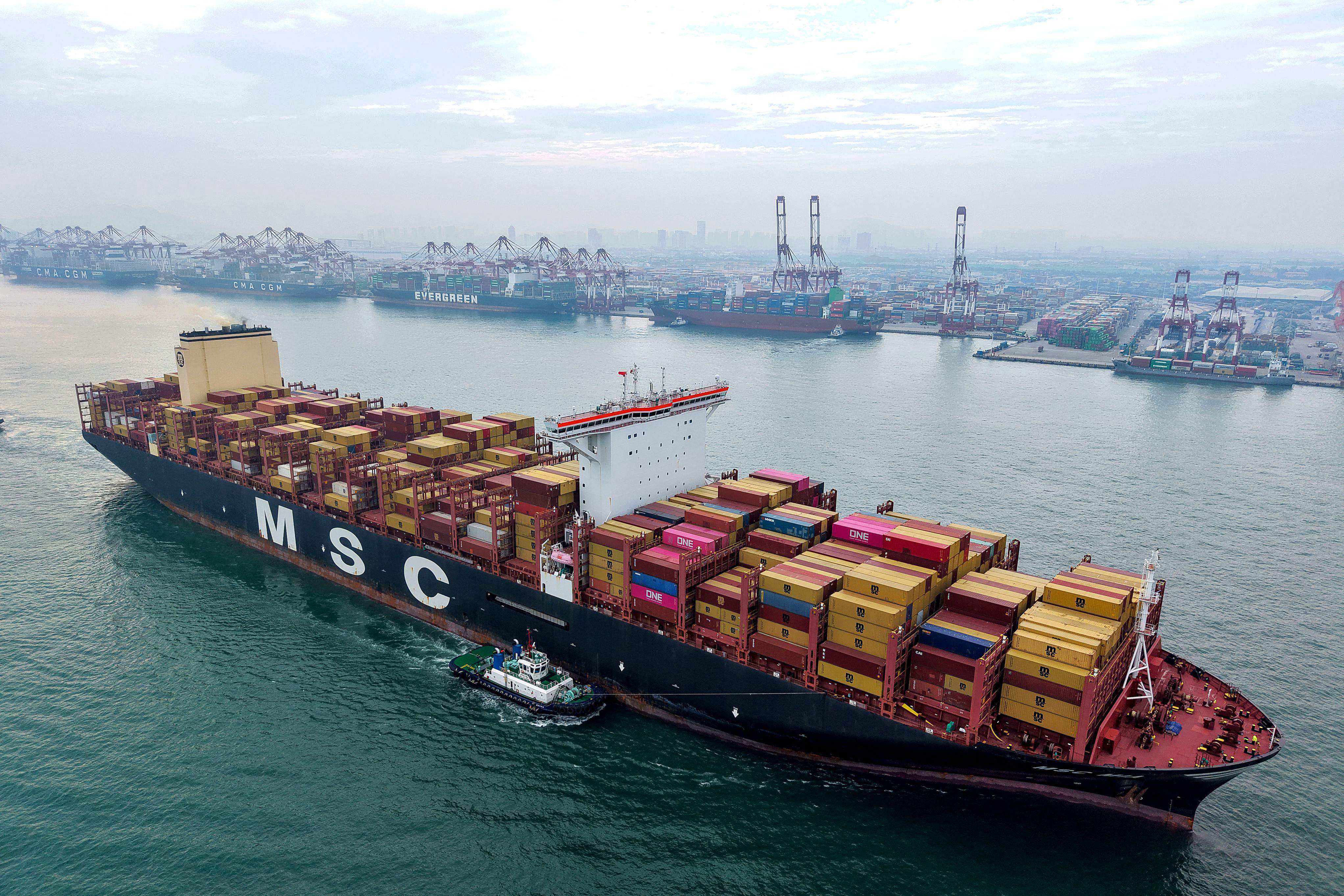 A container ship moves towards a berth at the container terminal of the port in Qingdao, in China’s eastern Shandong province, on September 24, 2025. Photo: AFP