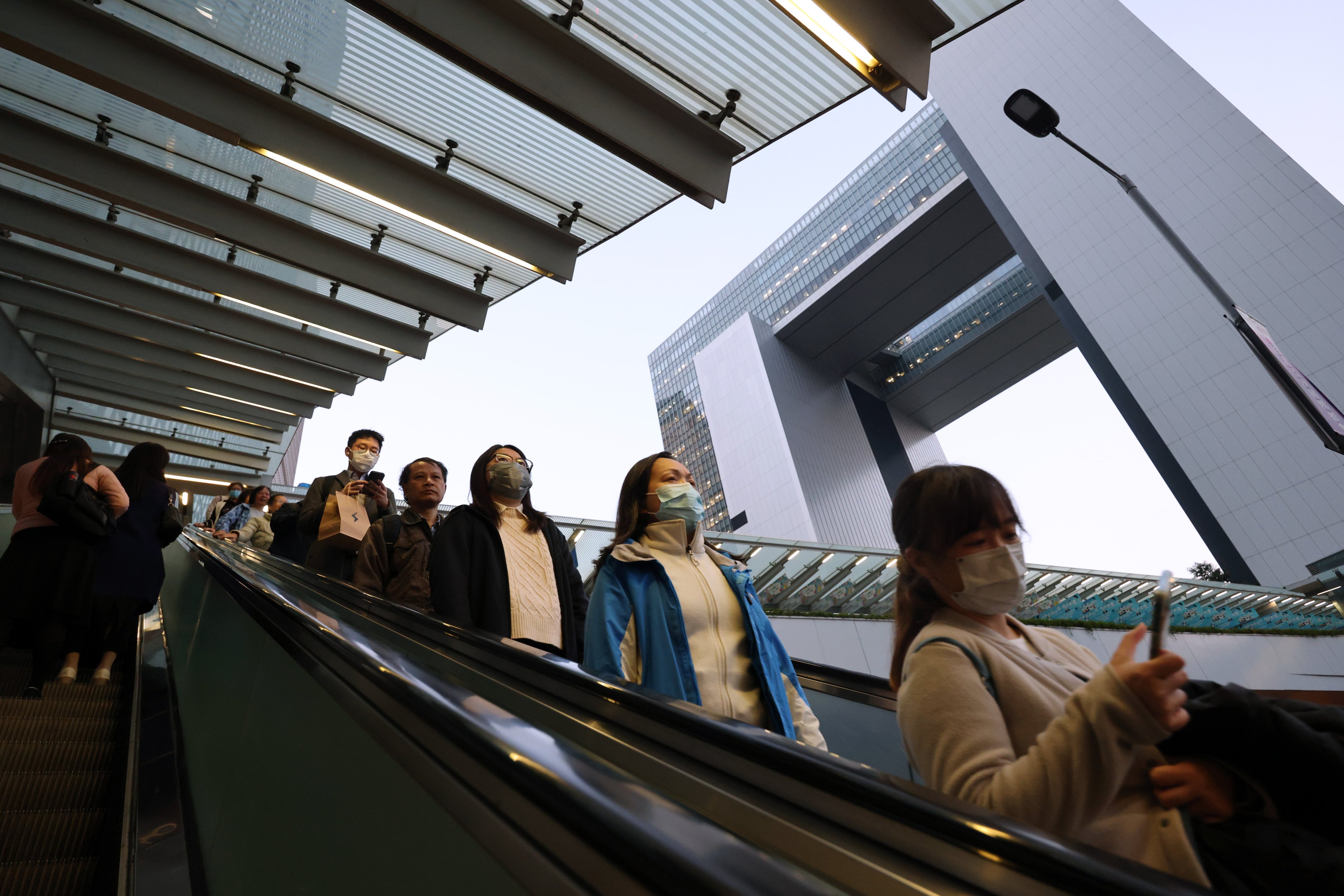 People ride the escalators at Hong Kong’s government offices in Tamar on January 6. Photo: Jelly Tse