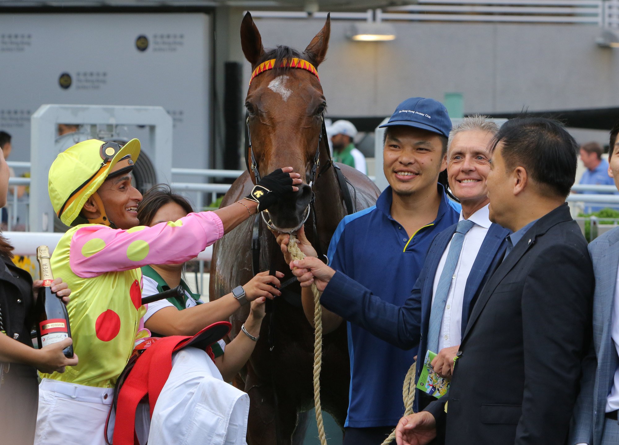 Jockey Karis Teetan, trainer Mark Newnham (second from right) and connections with Sing Dragon.