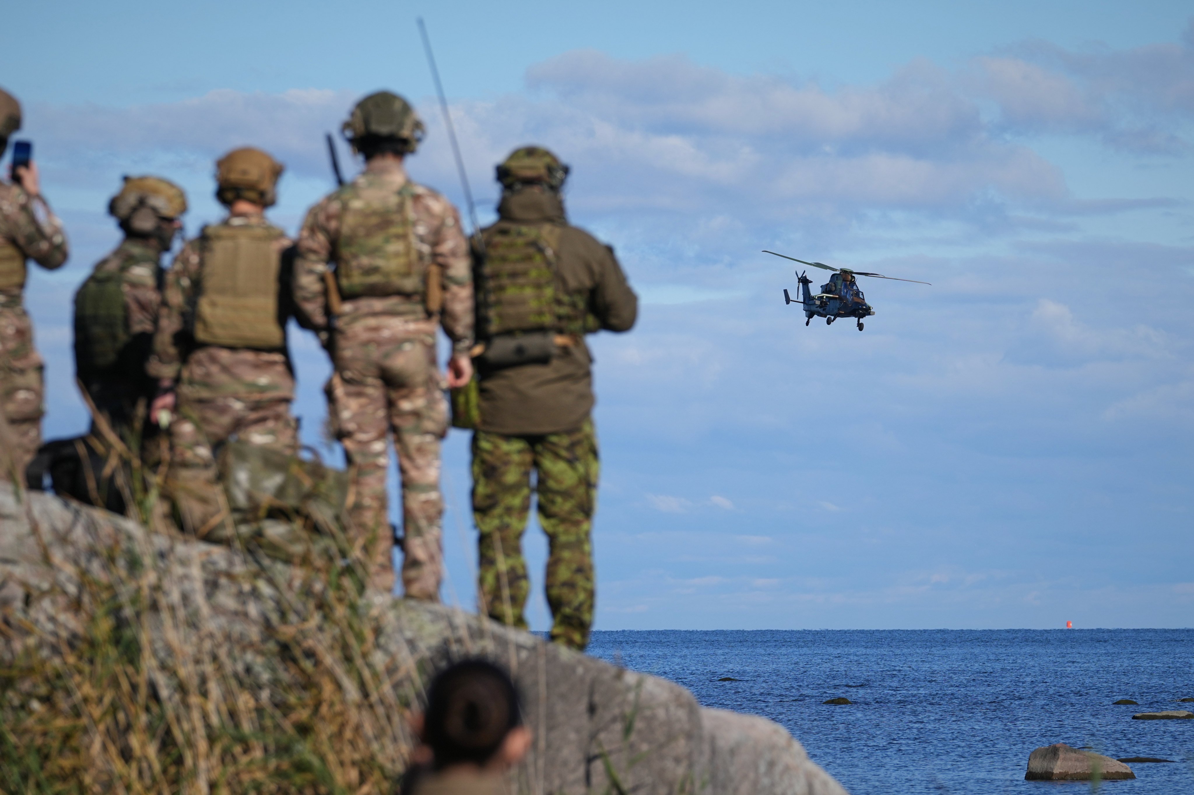 An Airbus Tiger multi-role attack helicopter flies away during a multinational military exercise near Suurekivi, Estonia, on September 30, days after three Russian fighter jets entered Estonian airspace. Photo: AP
