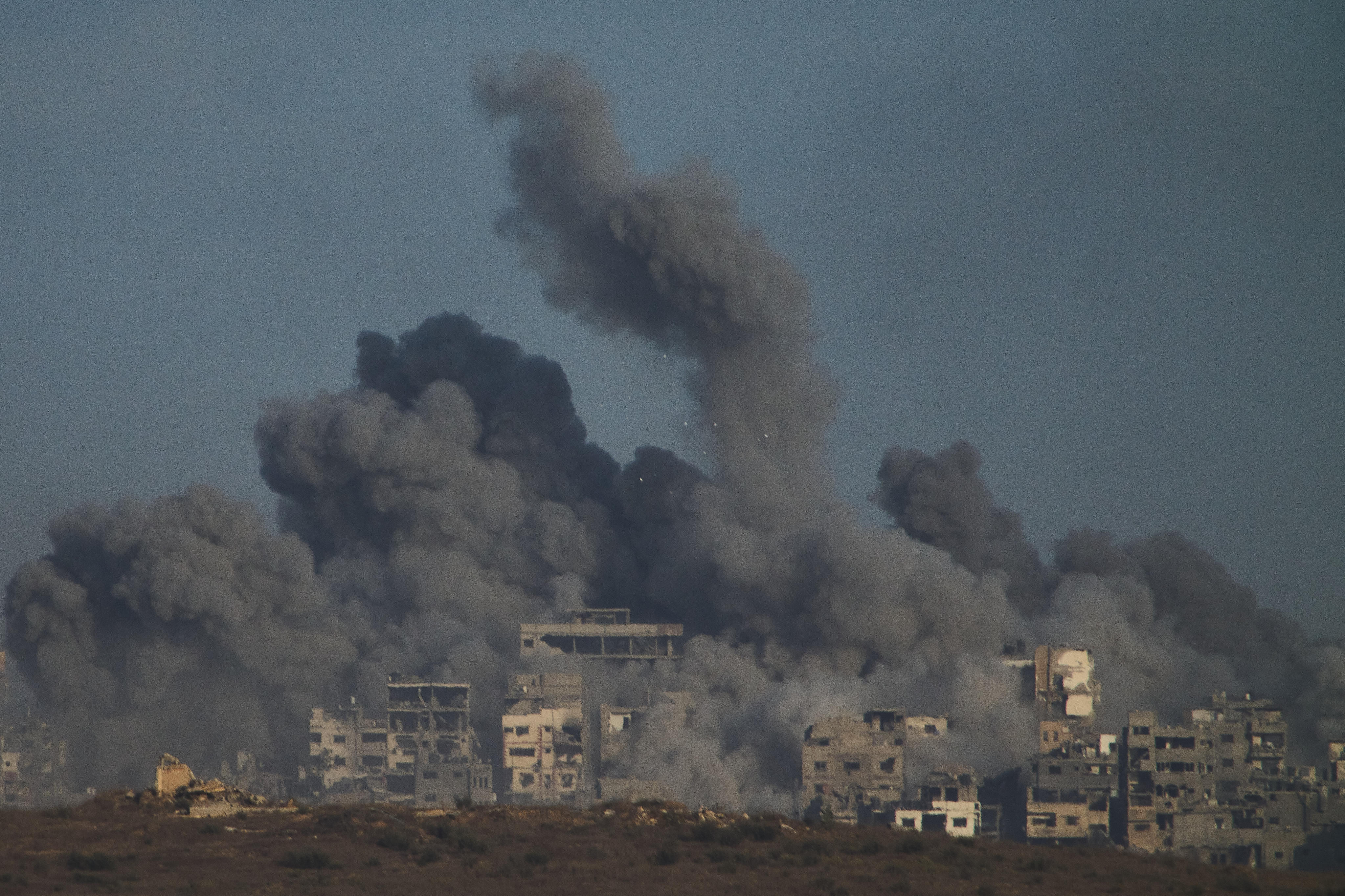 Smoke billows over Gaza Strip following an Israeli bombardment on Sunday. Photo: AP
