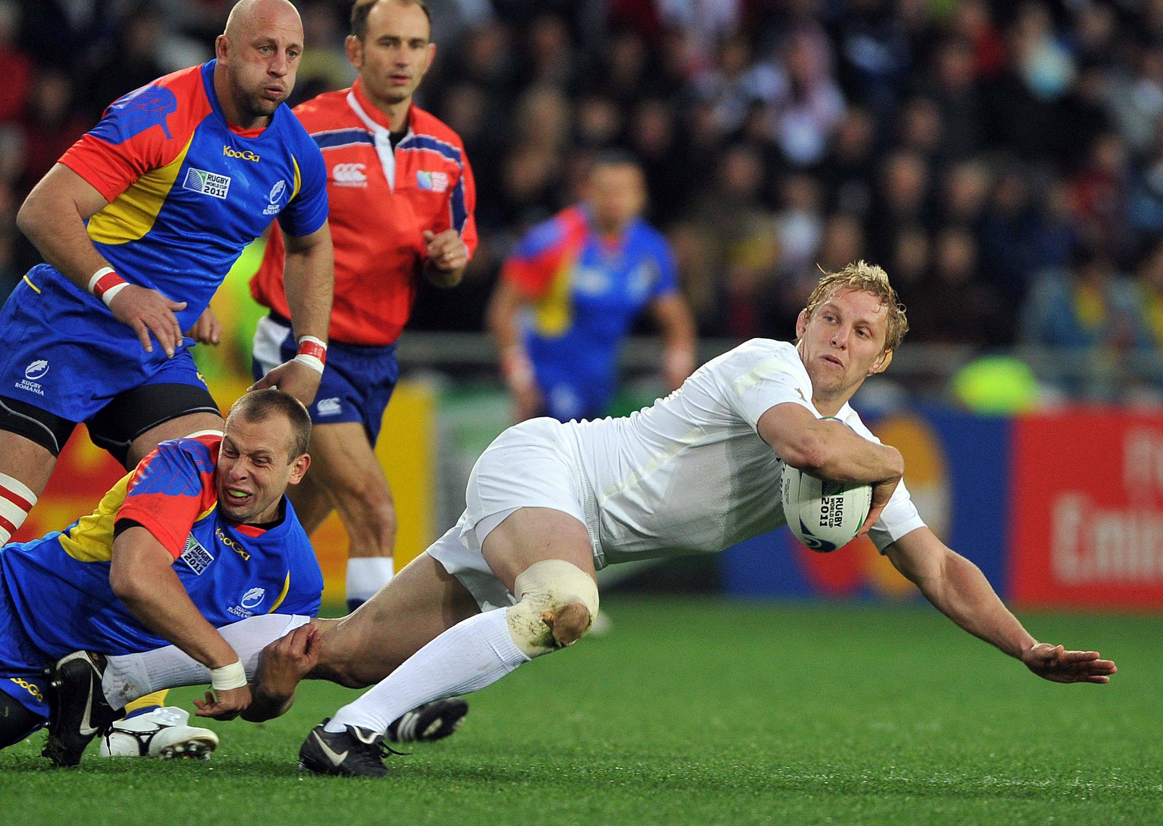 England flanker Lewis Moody (right) is tackled by Romanian fly-half Marin Dumbrava during their 2011 Rugby World Cup match in Dunedin, New Zealand. Photo: AFP