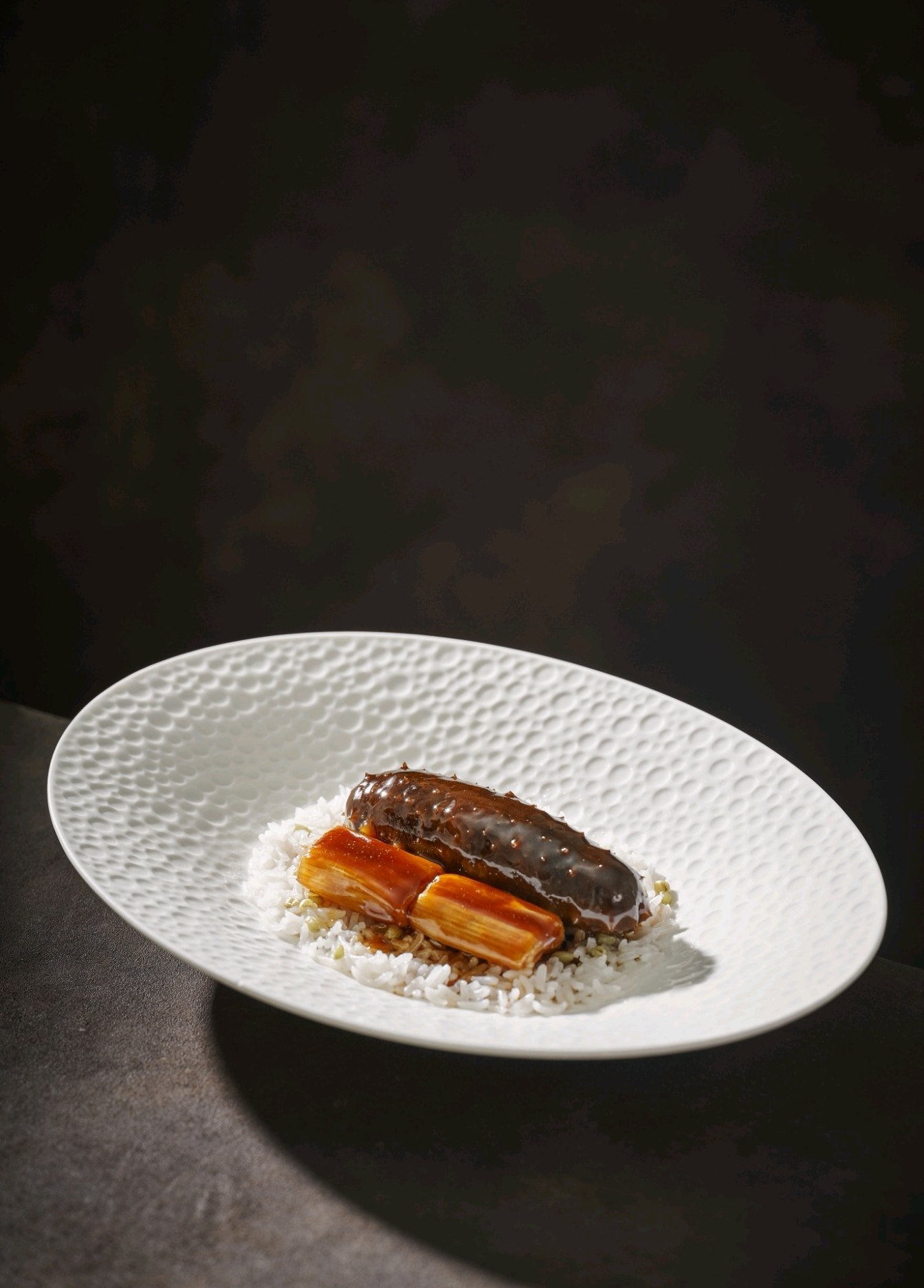 Chef Wang Haoquan’s signature braised sea cucumber with scallions is quintessentially Jiaodong cuisine. Photo: Ming Court