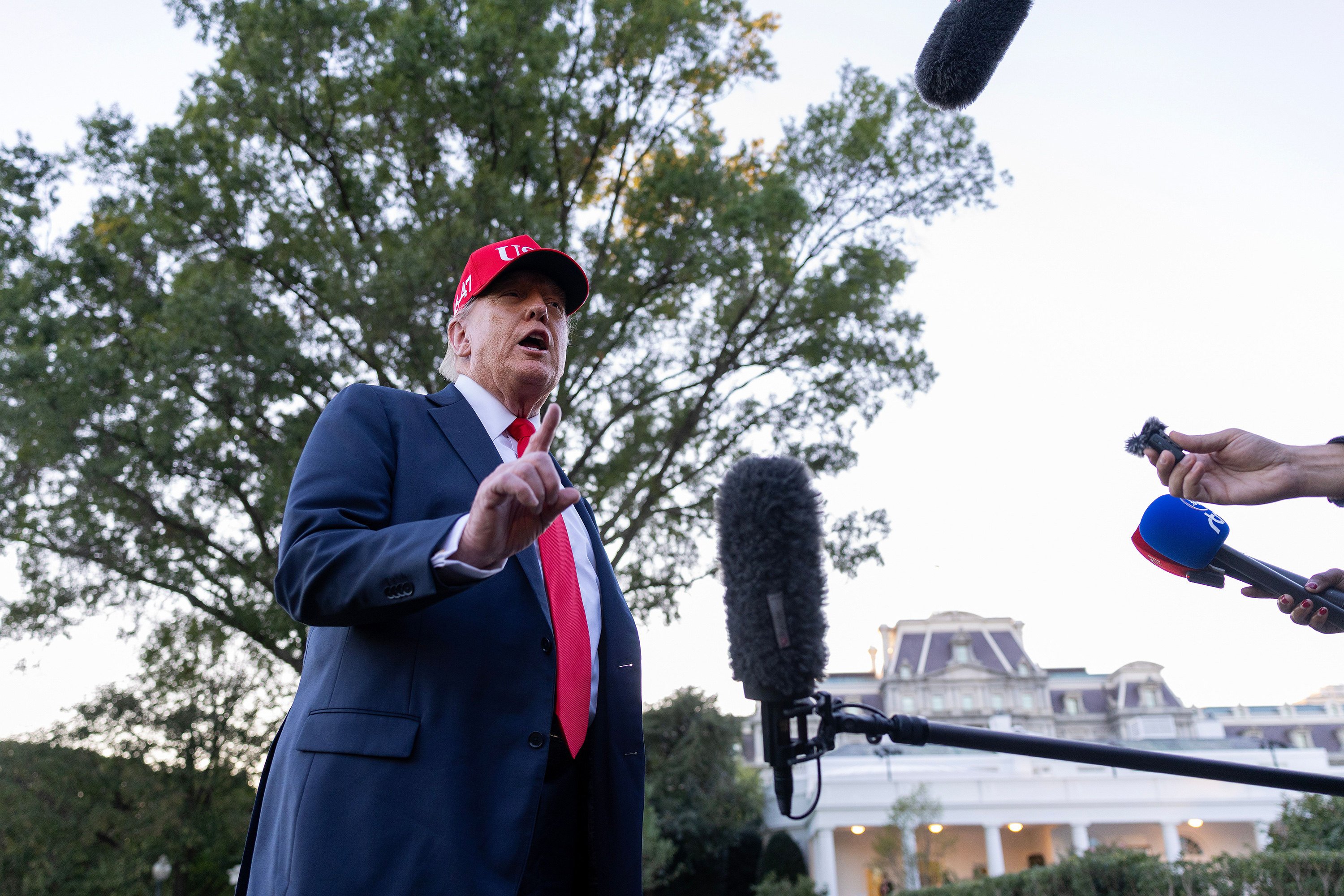 US President Donald Trump talks to the media  on the South Lawn of the White House on Sunday. Photo: Getty Images/TNS