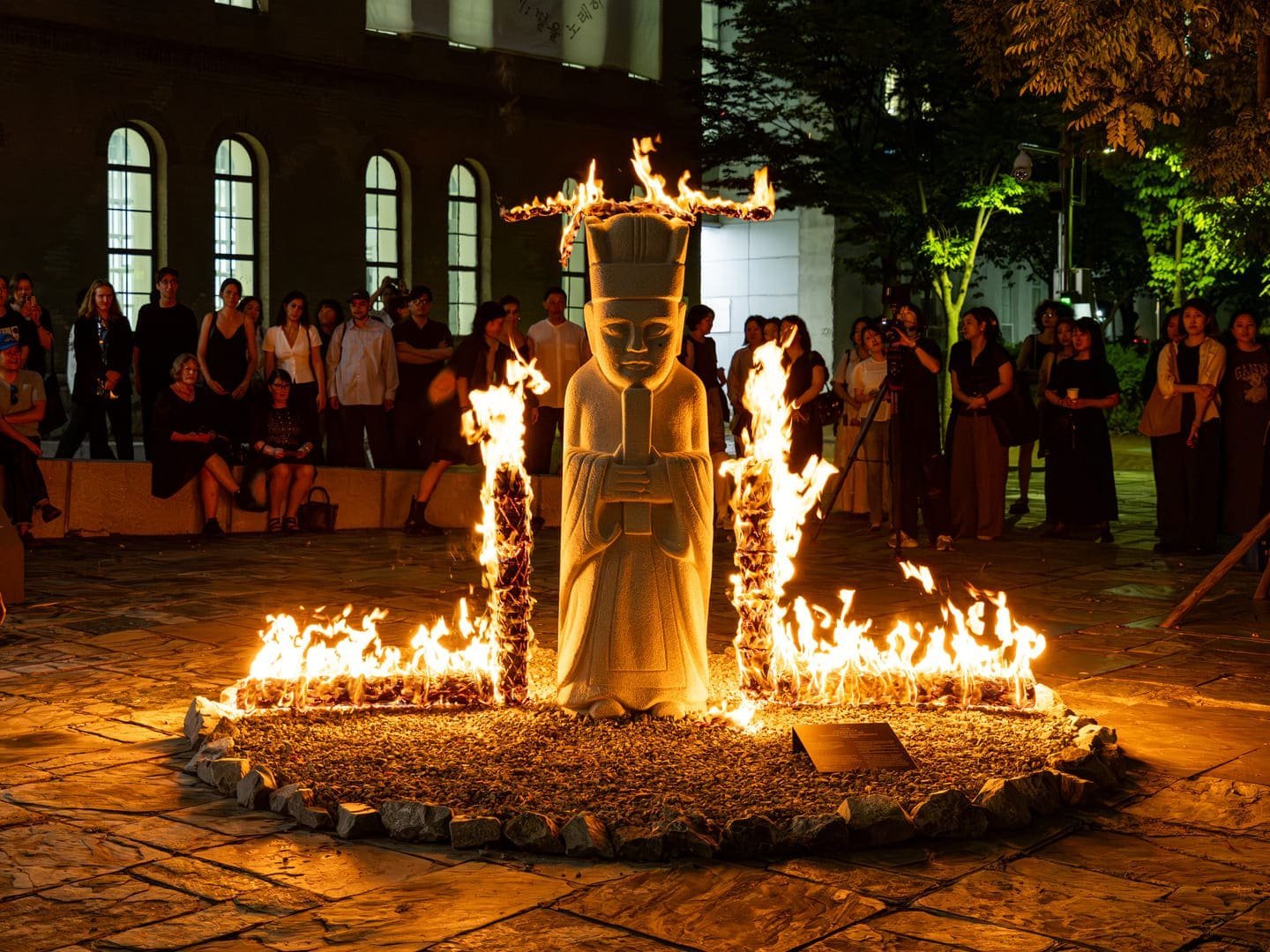 A reenactment of the Burning Performance 1989/2025, by Seung-taek Lee, is seen at the 13th Seoul Mediacity Biennale at the Seoul Museum of Art, in South Korea. Photo: Hong Cheolki